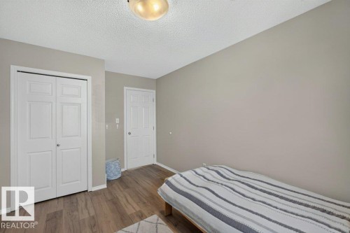 Wood-finish flooring with a neutral wall palette - #41 287 Macewan Rd Sw, Edmonton, AB 