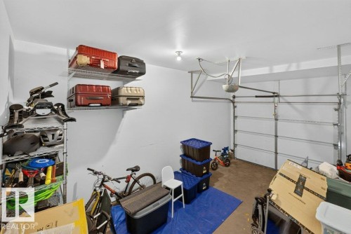 Attached garage with white walls and overhead lighting - #41 287 Macewan Rd Sw, Edmonton, AB 