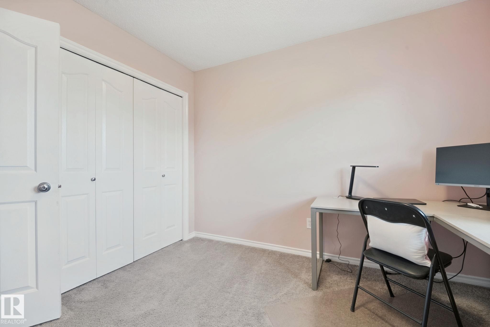 Neutral wall color, light gray carpet, and white trim - 324 Ascott Crescent, Sherwood Park, AB