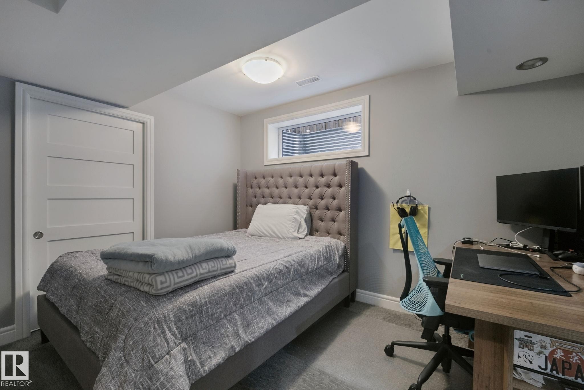 Wood-finish flooring, white paneled door, flush-mount ceiling light, recessed ceiling lighting, and a window with blinds - 324 Ascott Crescent, Sherwood Park, AB