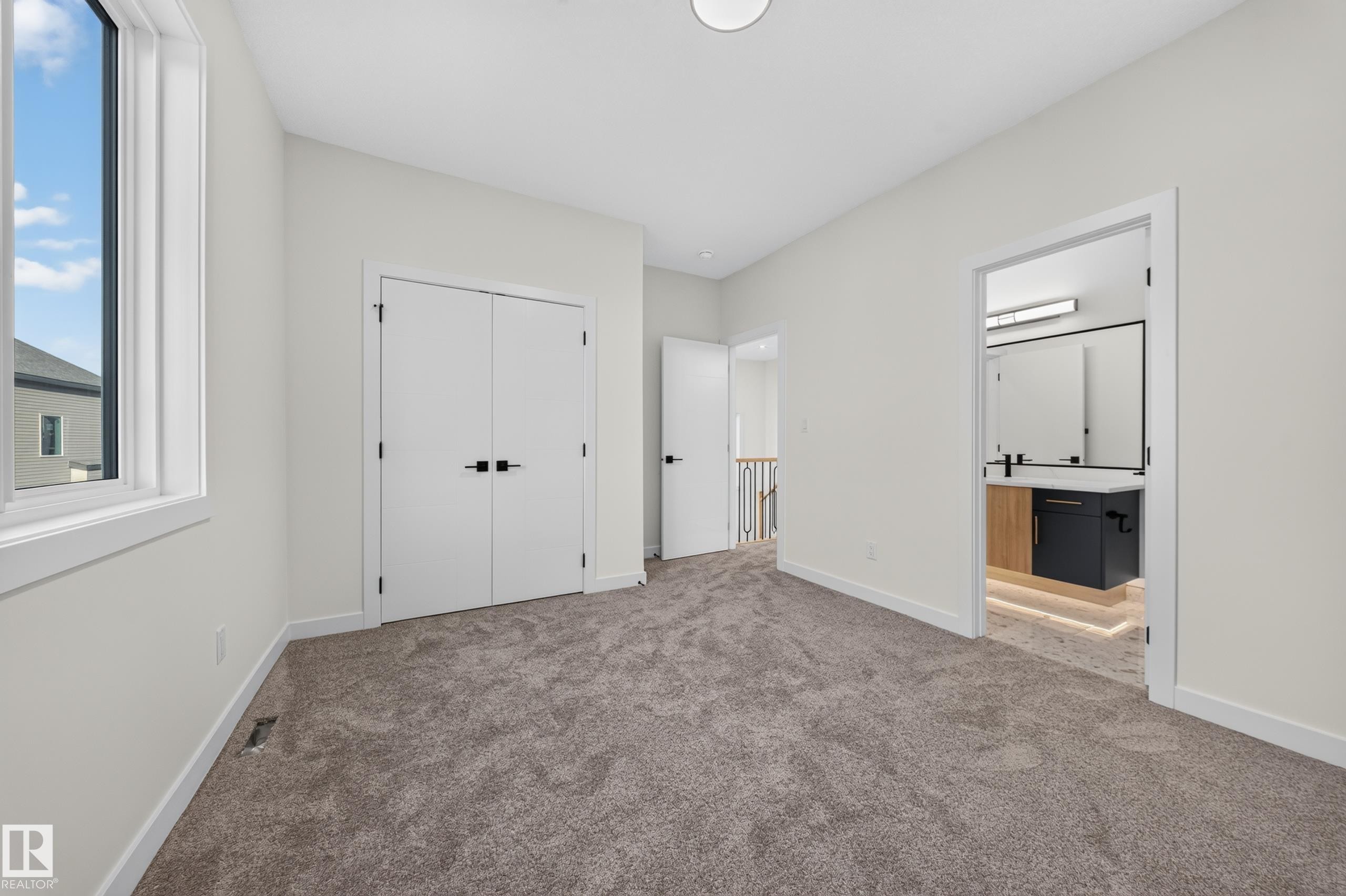 Recessed lighting, soft gray carpeting, white walls, and white trim - 13024 186 Avene Nw, Edmonton, AB