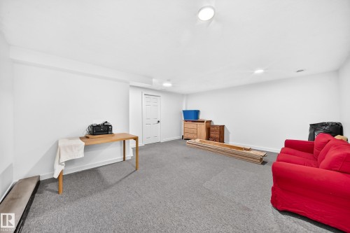 Recessed overhead lighting, white painted walls, and gray carpeting - #27 287 Macewan Rd Sw, Edmonton, AB 