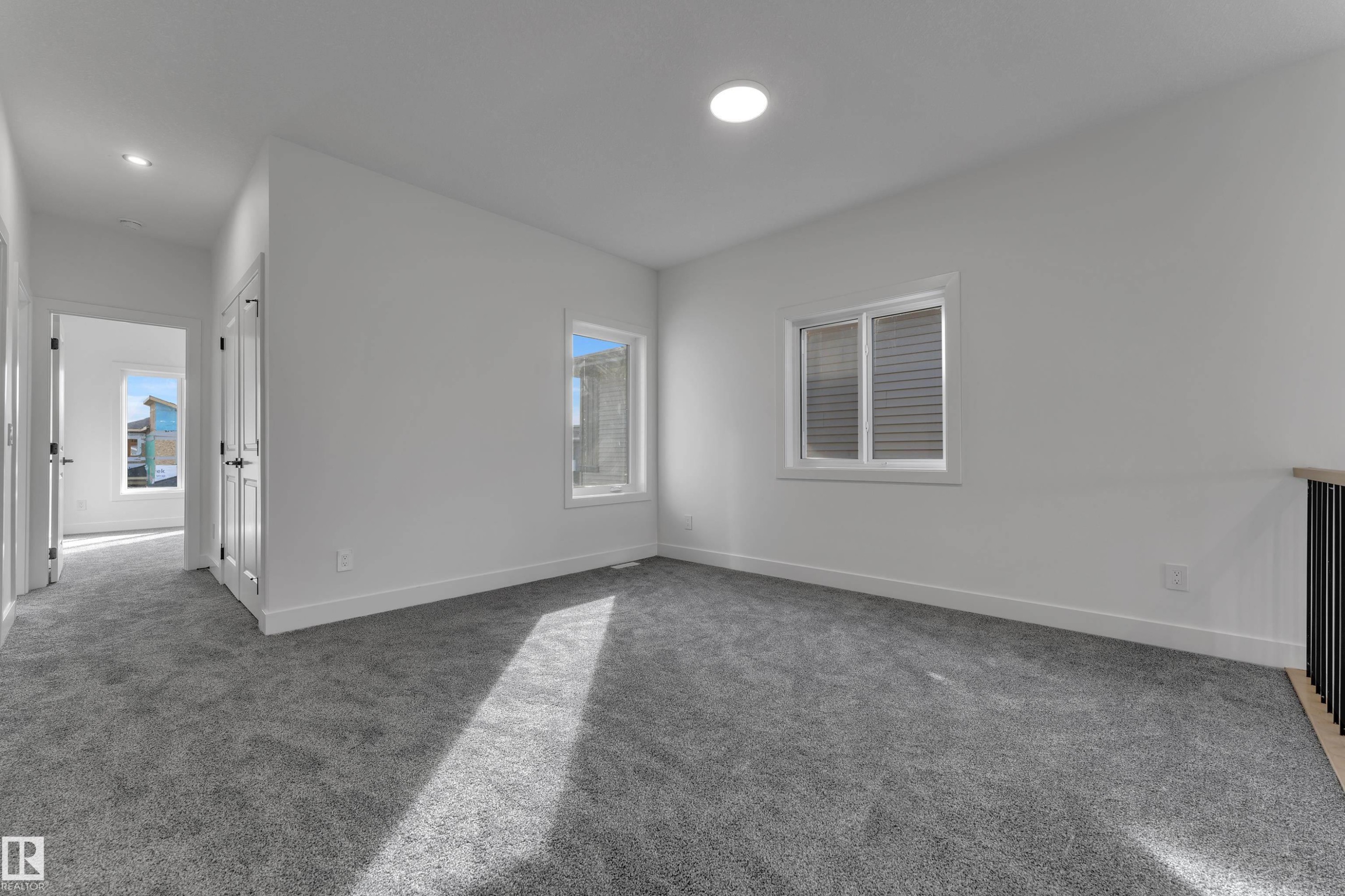 Recessed lighting, gray carpeting, white walls, and white trim - 247 Linden Loop, Leduc, AB