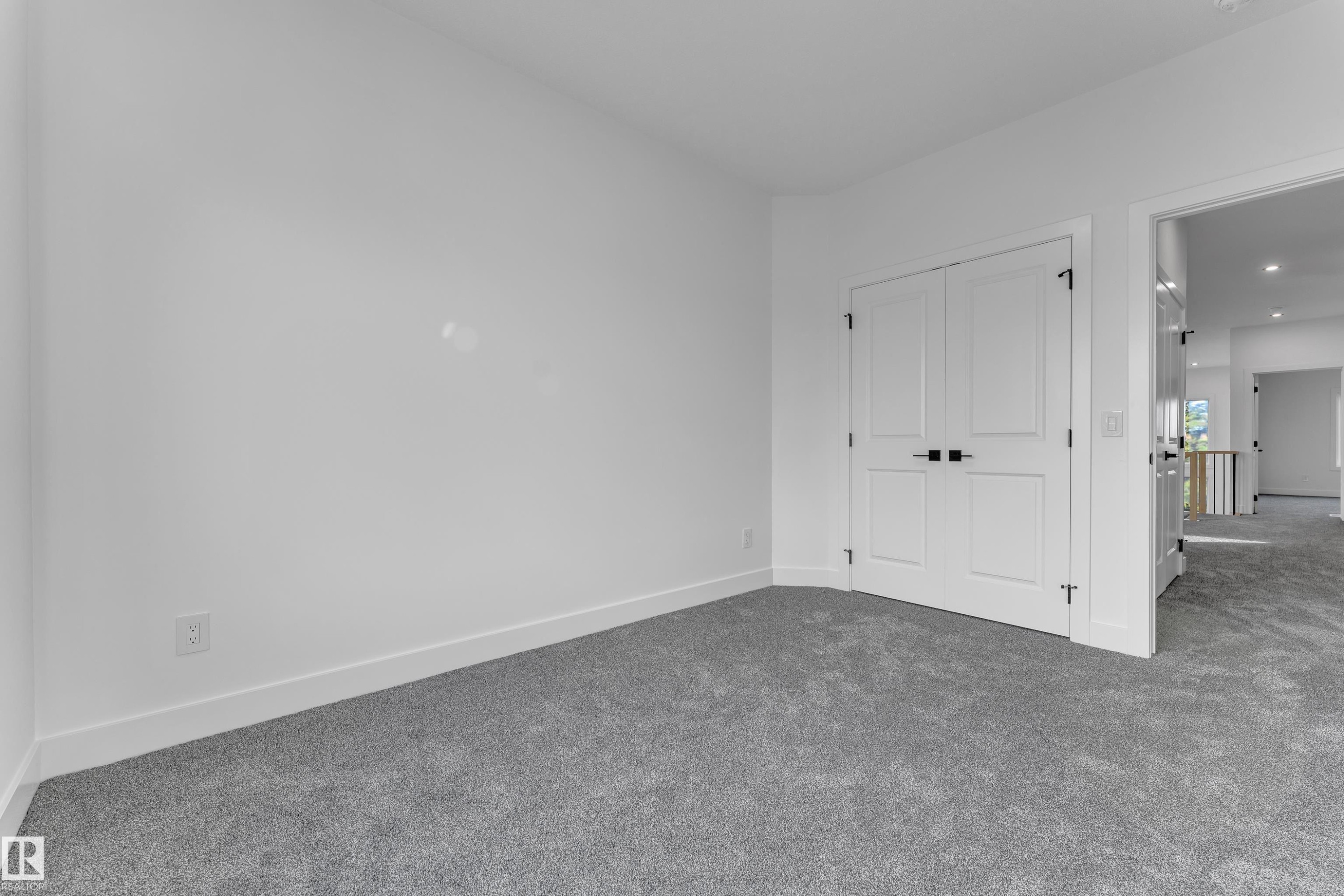 Neutral color palette with light gray carpeting, white walls, and white trim - 247 Linden Loop, Leduc, AB