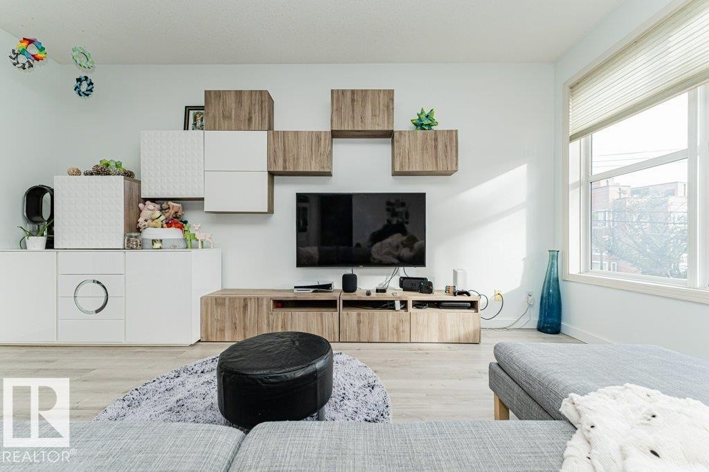 Recessed lighting and light wood-finish flooring - #202 9503 101 Av Nw, Edmonton, AB