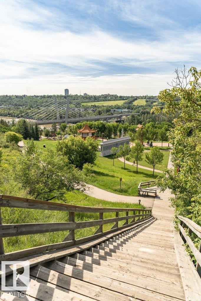 Expansive outdoor staircase with wood railings - #202 9503 101 Av Nw, Edmonton, AB
