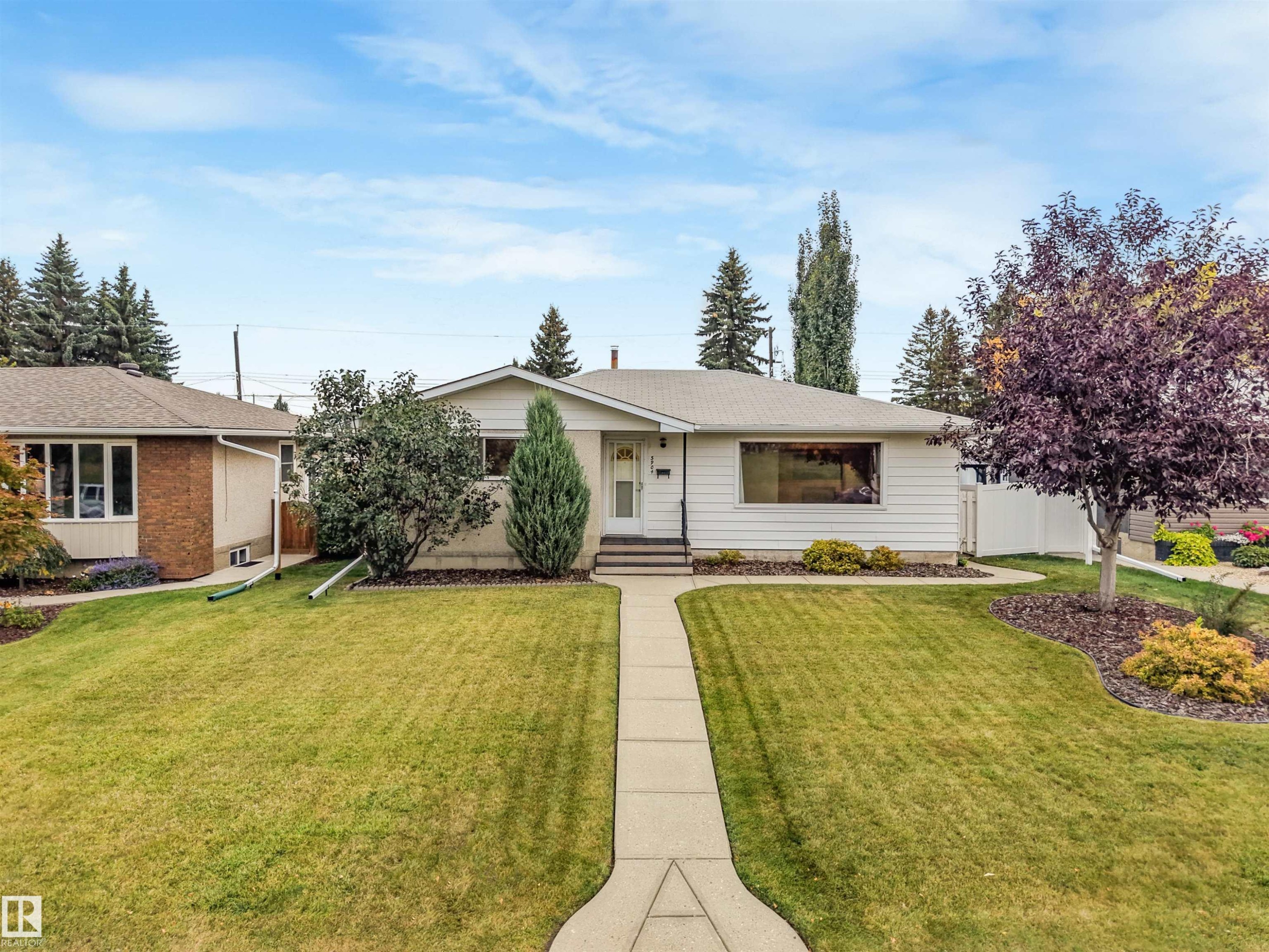 Single-story residence featuring a white siding exterior and a front-facing window - 5904 94 Avenue Nw, Edmonton, AB