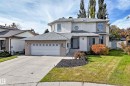 Stucco and brick exterior with a front-facing garage - 5830 181 Street Nw, Edmonton, AB 