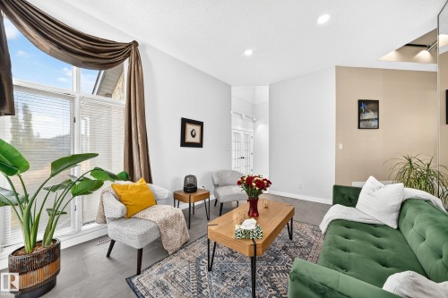 Vaulted ceilings and large-format tile flooring create an open atmosphere - 5830 181 Street Nw, Edmonton, AB 
