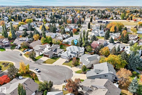 Residential neighborhood with mature trees, established landscaping, and varied architectural styles - 5830 181 Street Nw, Edmonton, AB 
