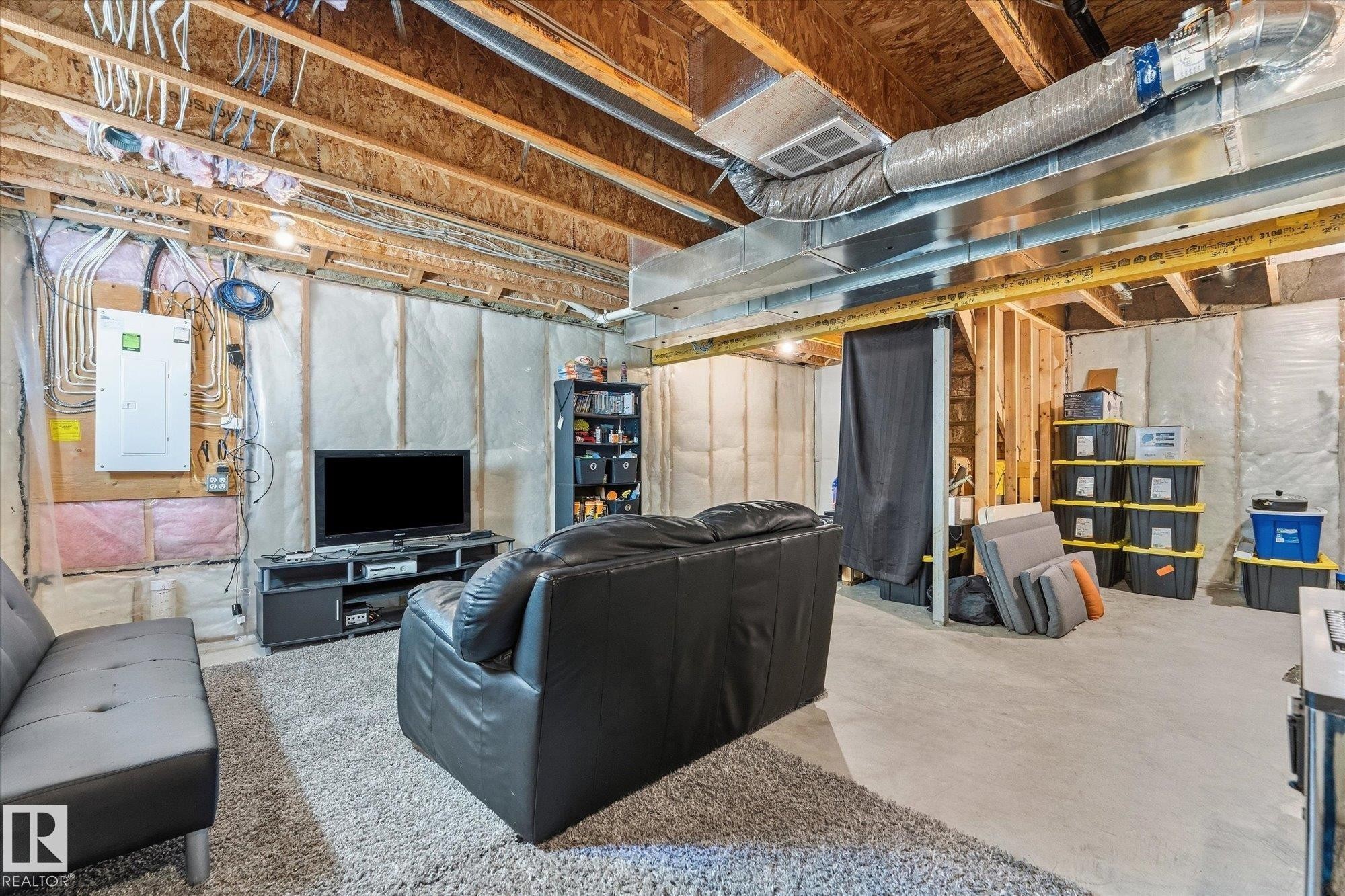 Exposed ceiling joists and ductwork with concrete flooring - #15 4835 Wright Dr Sw, Edmonton, AB