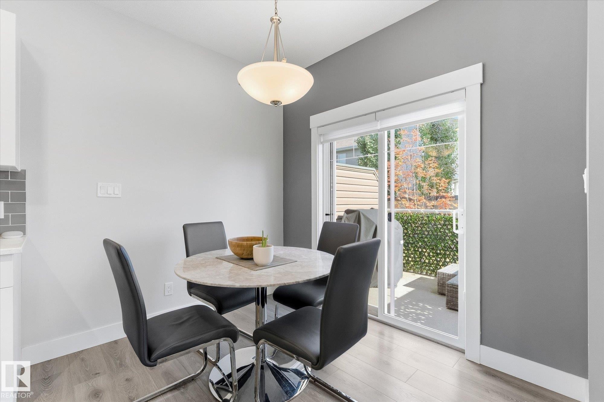 Wood-finish flooring, recessed lighting, sliding glass door, and a private outdoor space - #15 4835 Wright Dr Sw, Edmonton, AB