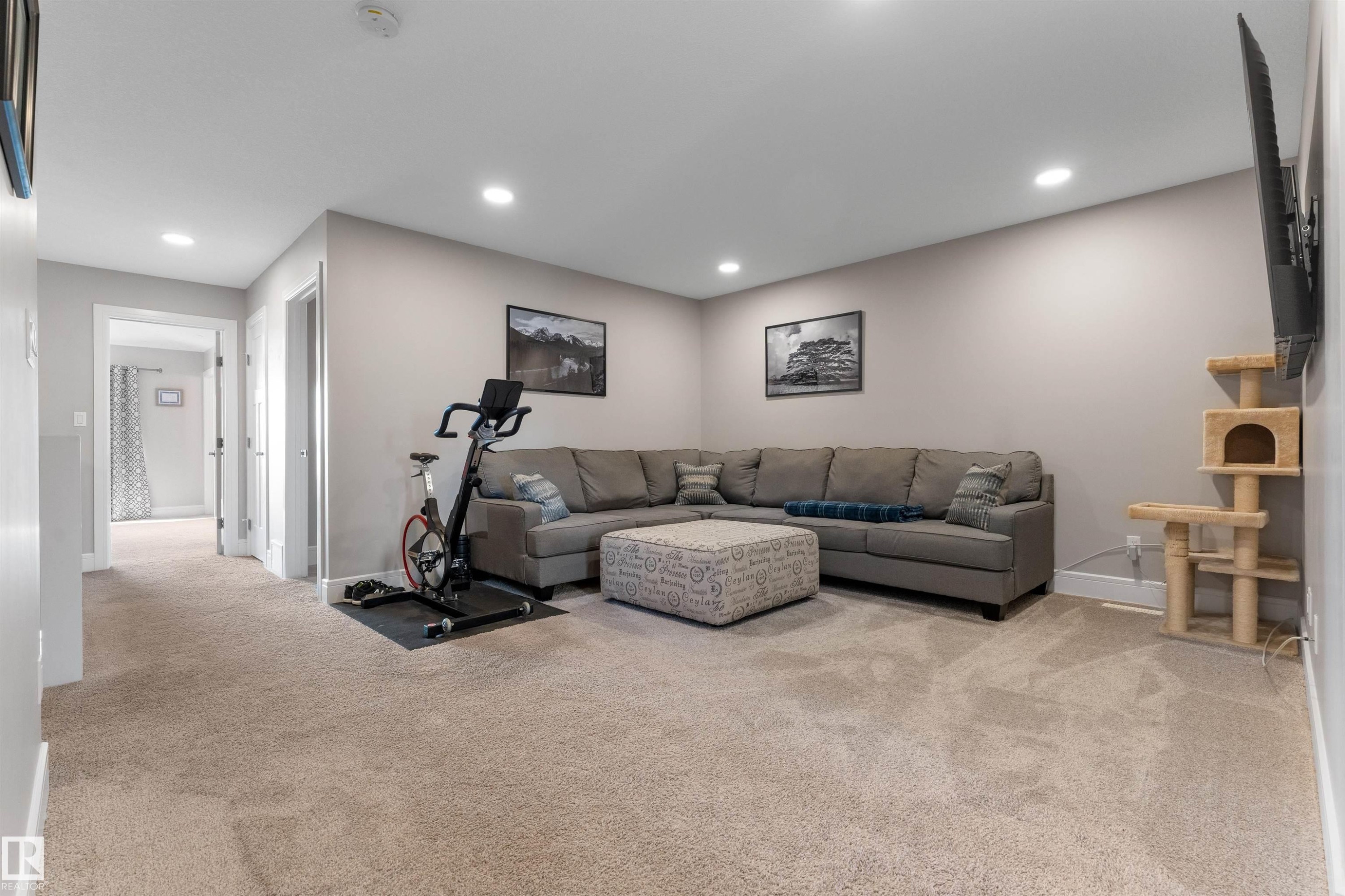 Carpeted flooring, recessed lighting, neutral wall paint, and white trim - 3334 Parker Loop Sw, Edmonton, AB