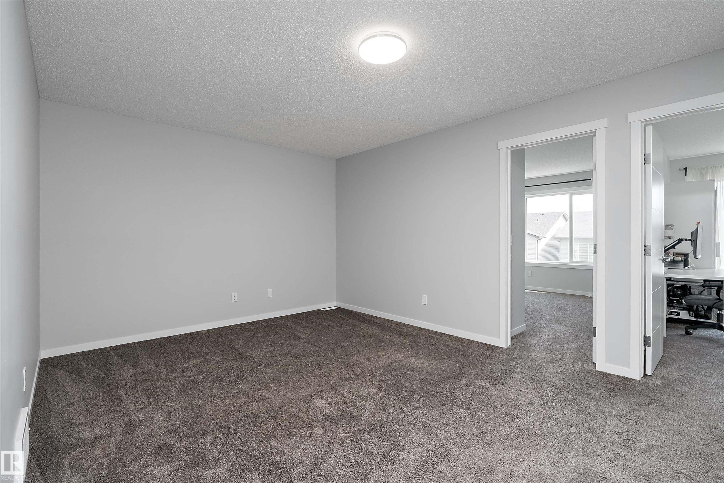 Plush carpeting, recessed lighting, and bright white trim - 9227 223 Street Nw, Edmonton, AB