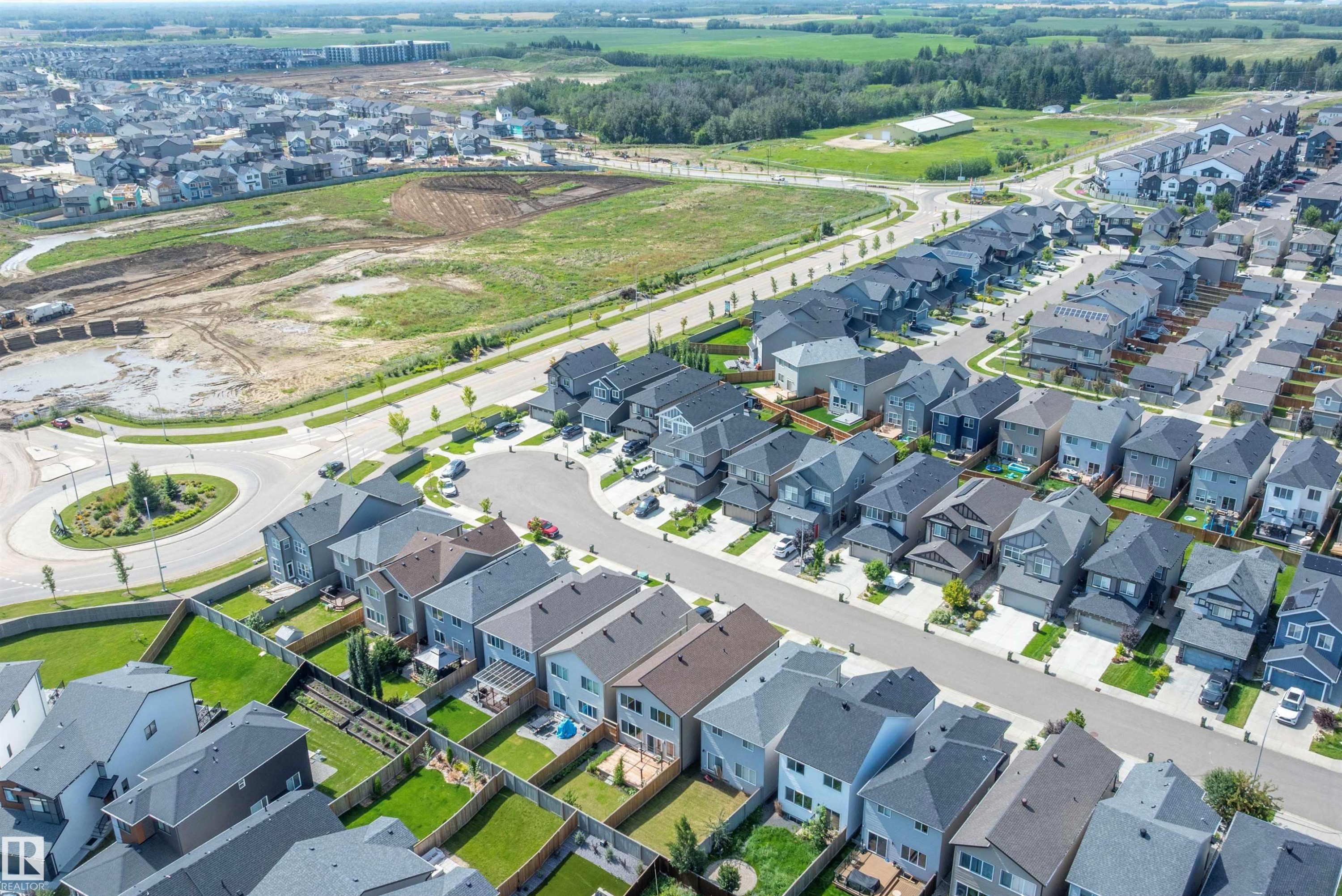 Aerial perspective showcasing a residential community with varied architectural styles - 9227 223 Street Nw, Edmonton, AB
