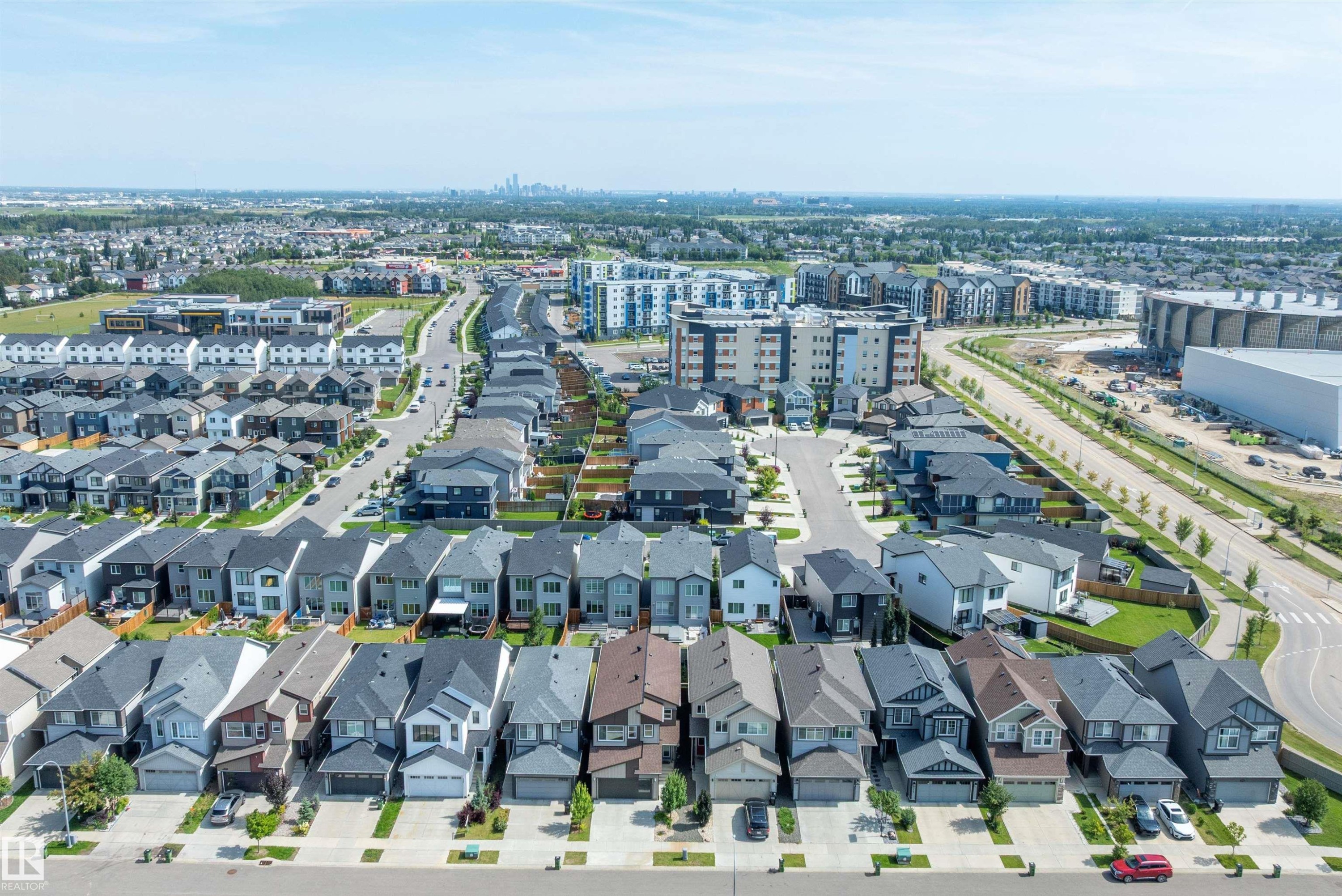 Expansive suburban development featuring single-family residences, multi-story residential buildings, and commercial structures - 9227 223 Street Nw, Edmonton, AB