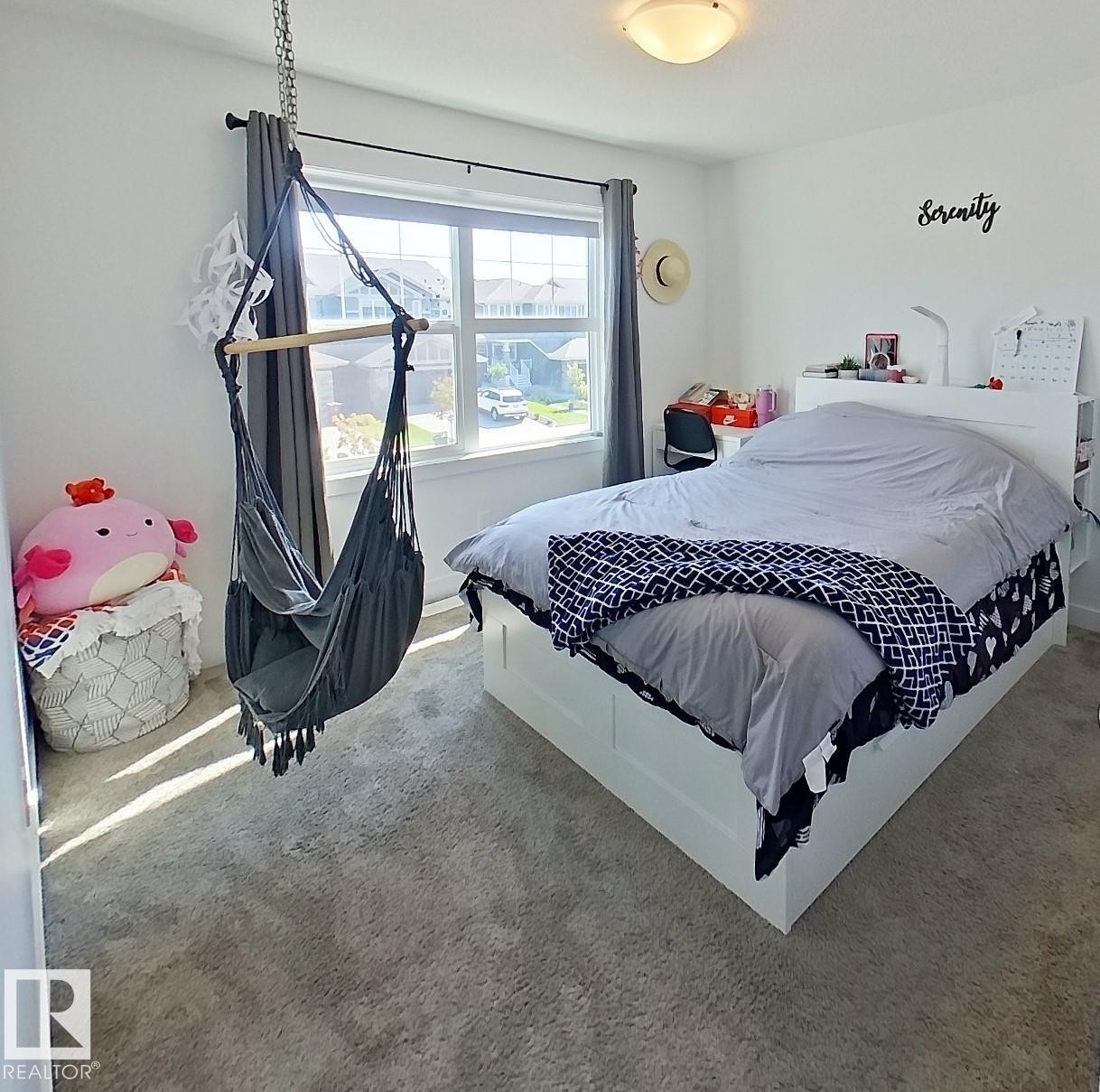 Neutral tone wall paint, flush mount ceiling light fixture, and carpet flooring - 40 Jamison Crescent, St. Albert, AB