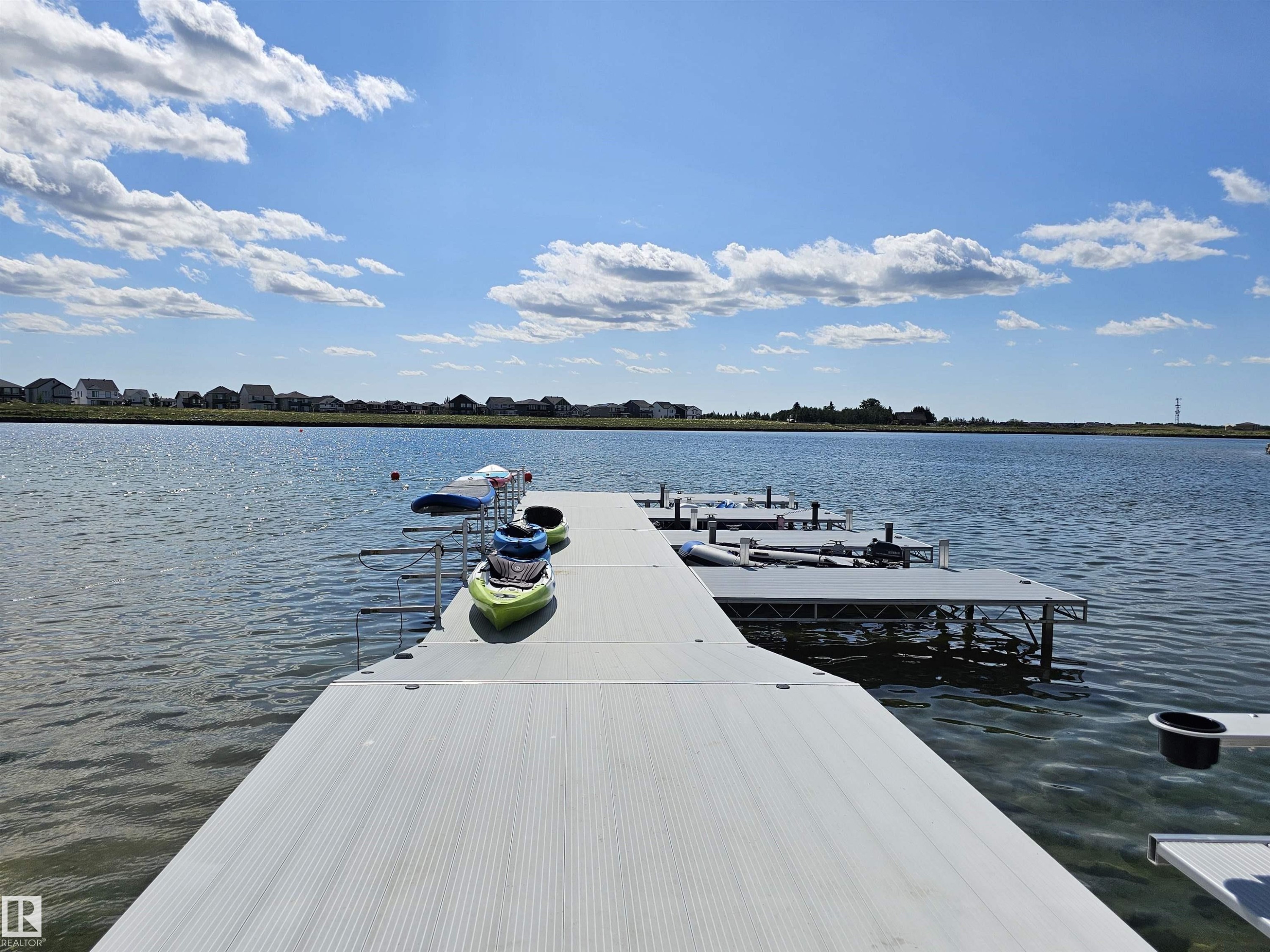 Private dock system with water access, featuring multiple boat slips and a built-in ladder - 40 Jamison Crescent, St. Albert, AB