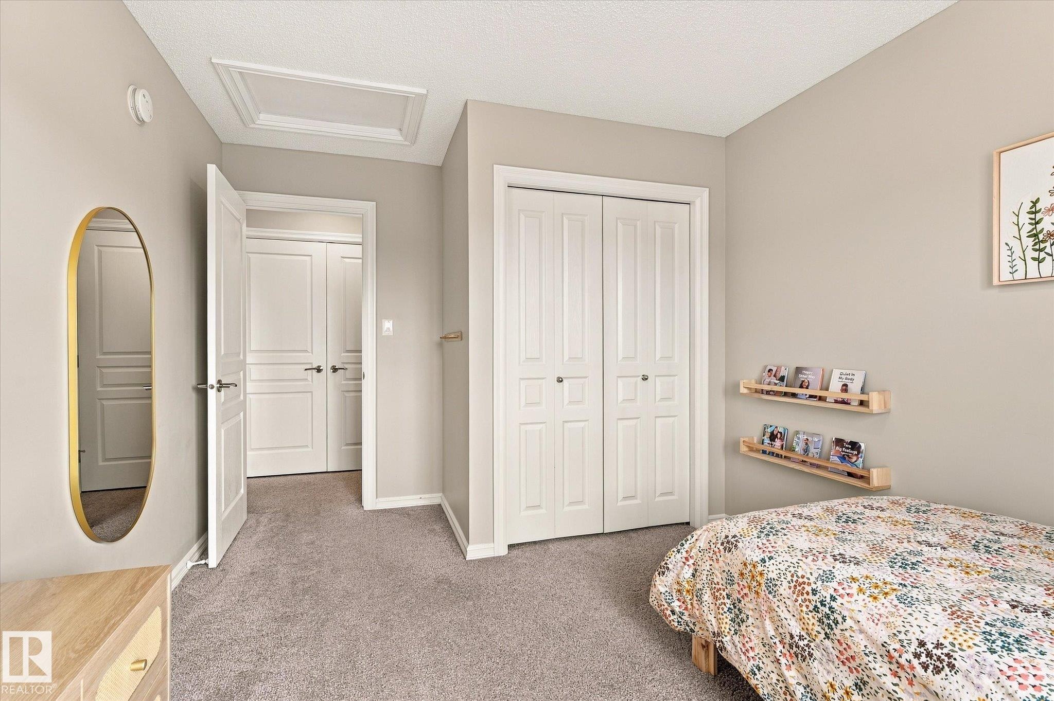 Neutral-toned walls complement the gray carpeting - 21935 91 Avenue Nw, Edmonton, AB