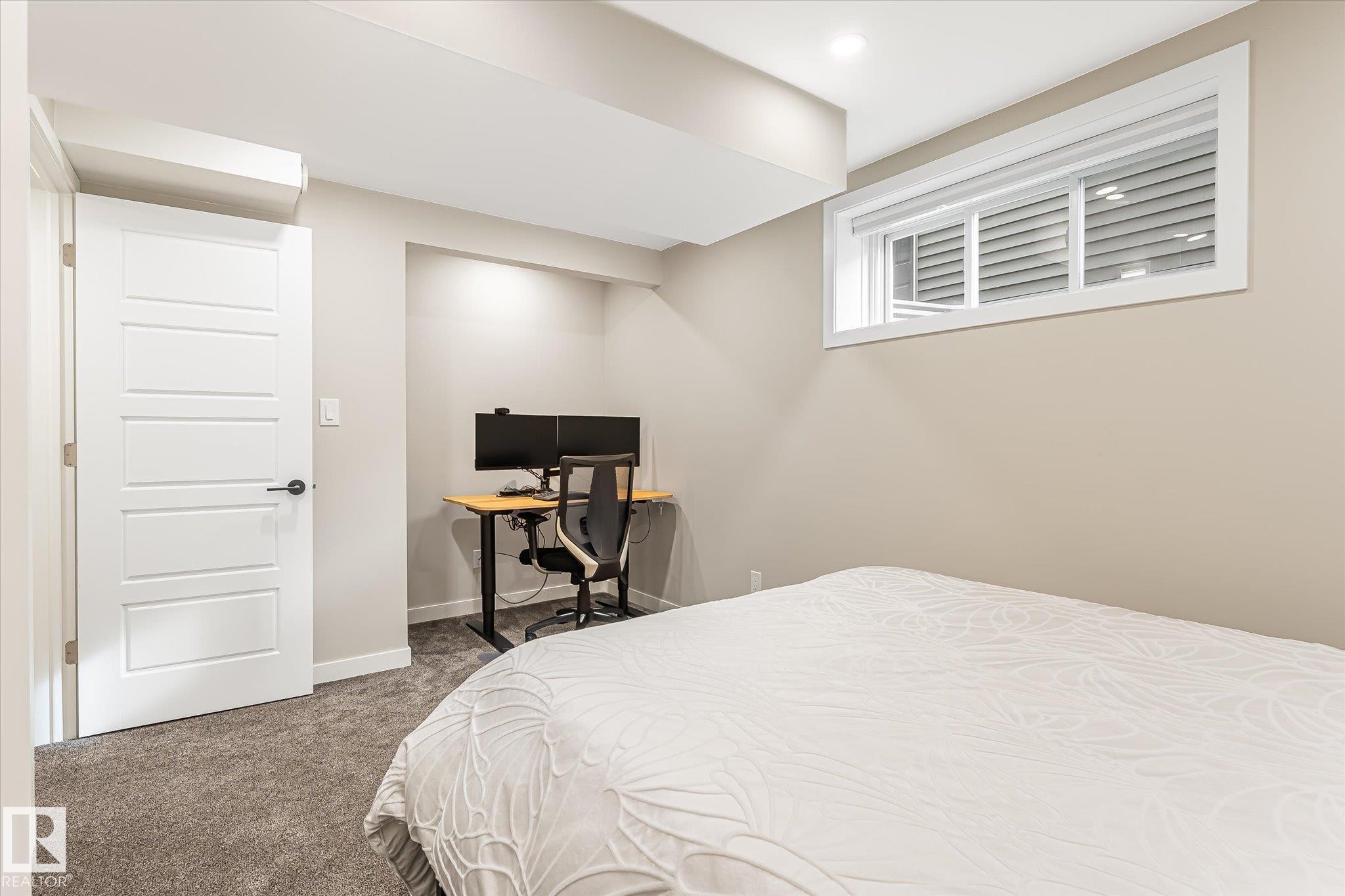 Recessed lighting, painted walls, carpeted flooring, and a white interior door - 21935 91 Avenue Nw, Edmonton, AB