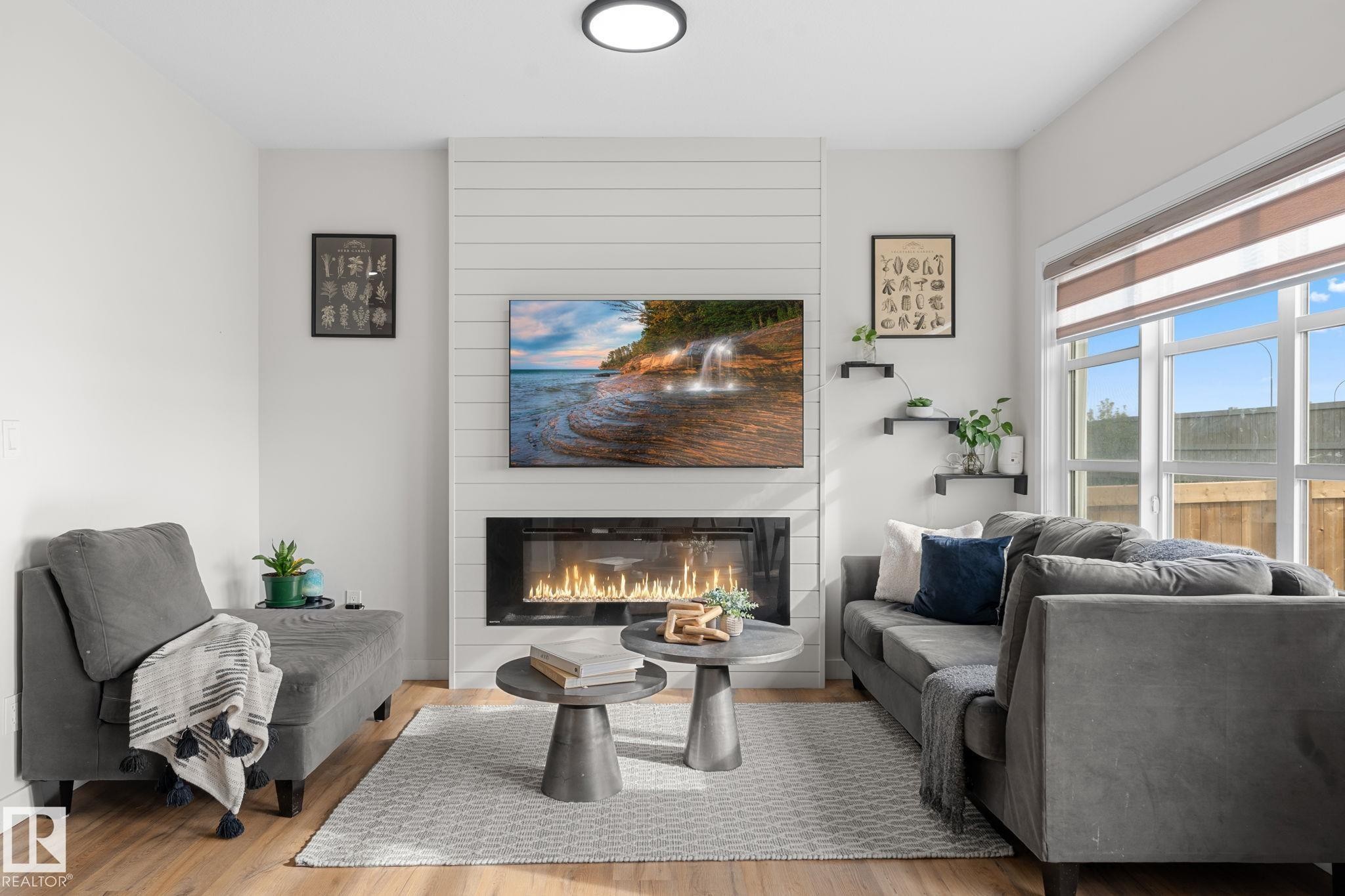 Shiplap accent wall with built-in linear fireplace - 1142 Goldfinch Crescent Nw, Edmonton, AB