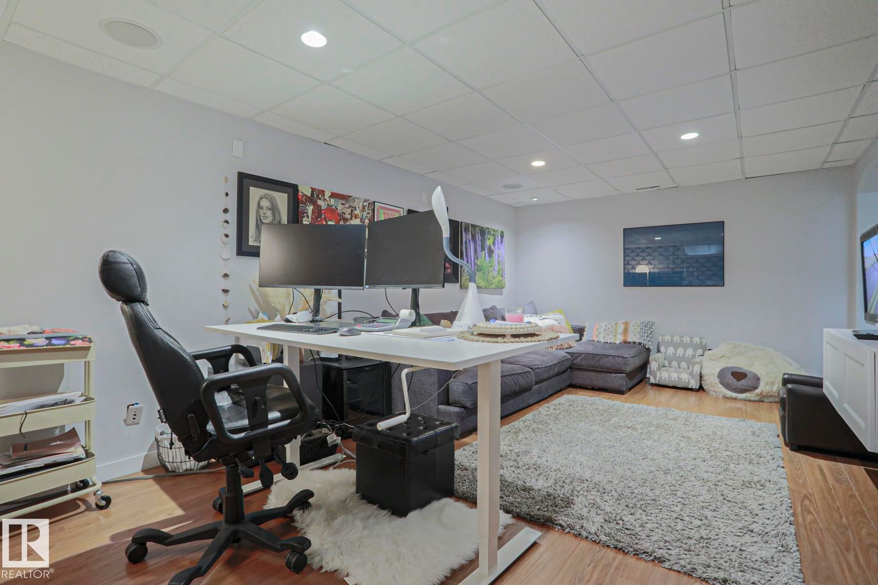 Wood-finish flooring, recessed lighting, drop ceiling, and neutral wall tones - 5 Gilmore Crescent, St. Albert, AB