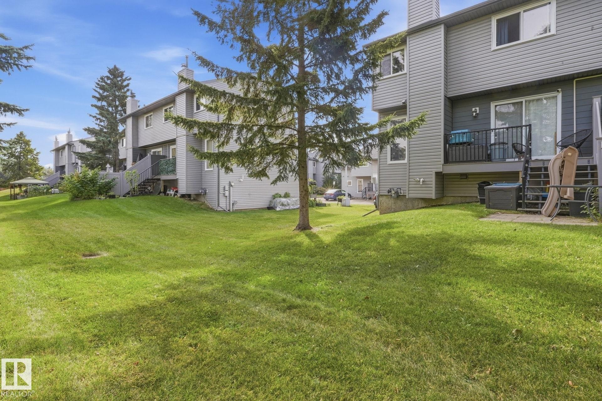 Expansive green space featuring mature trees and a gazebo - 5340 38A Avenue Nw, Edmonton, AB