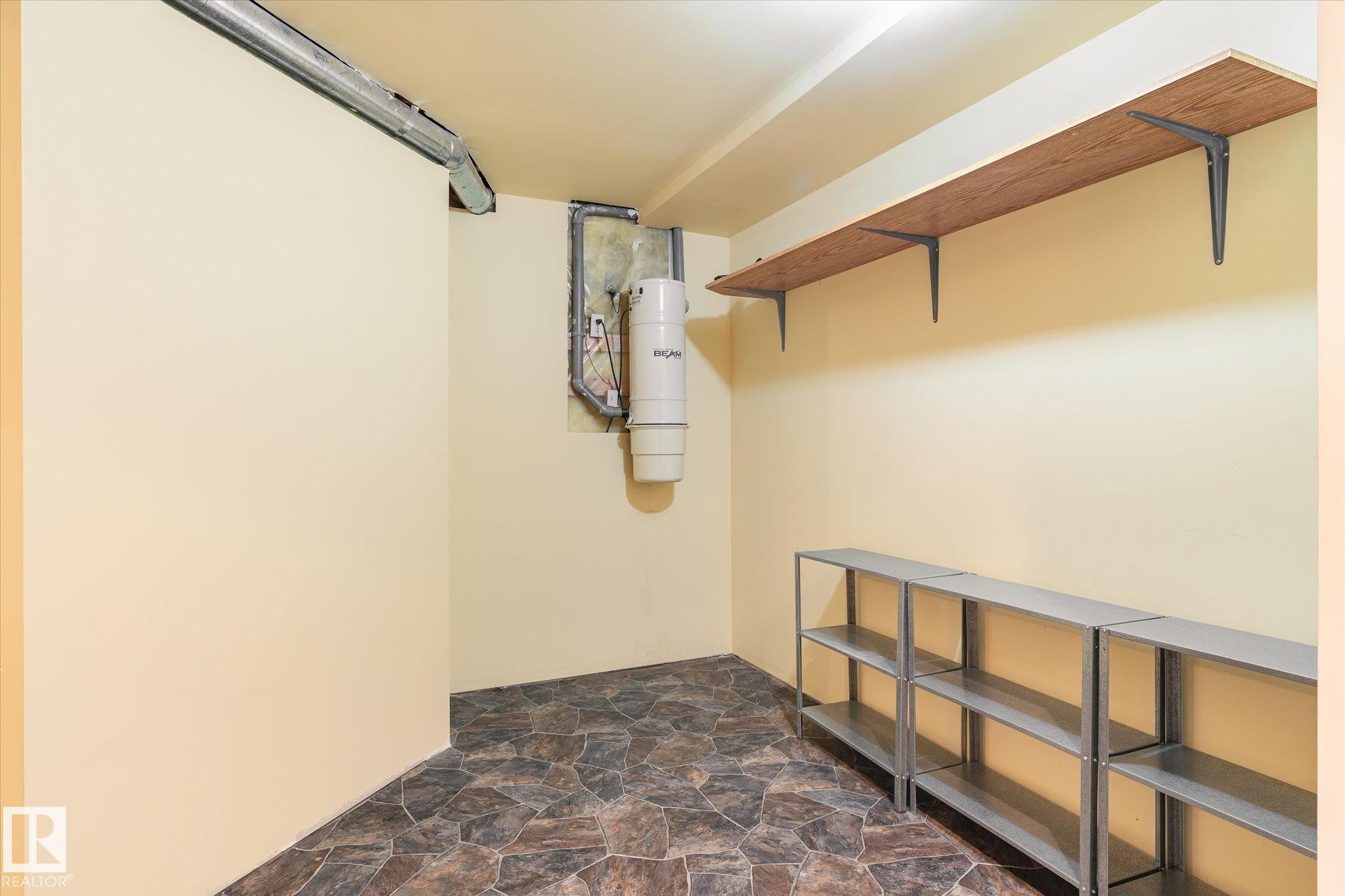 Wall-mounted shelving system, wood-finish wall shelf, and stone-look flooring - 2550 Rabbit Hill Road Nw, Edmonton, AB