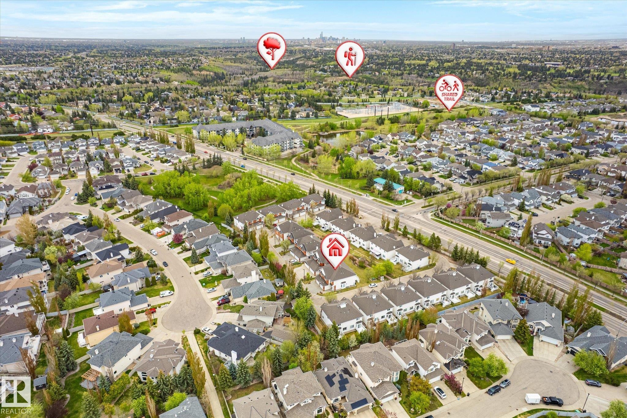 Aerial perspective showcasing a residential community with abundant green spaces, established streets, and mature landscaping - 2550 Rabbit Hill Road Nw, Edmonton, AB