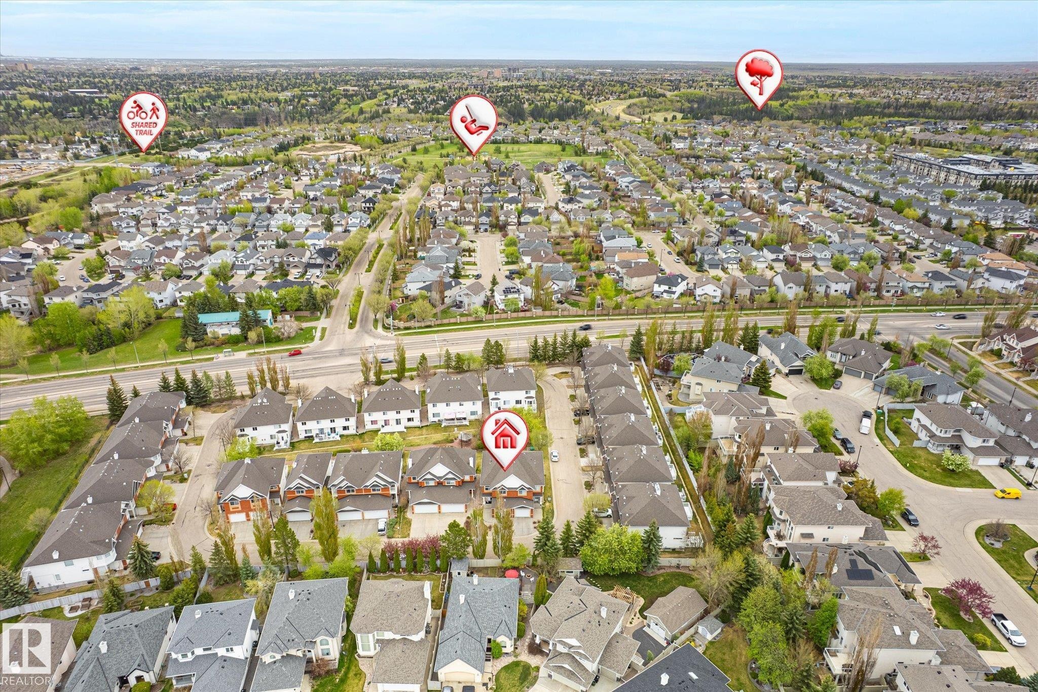 Aerial perspective of a developed residential area with multiple detached and attached properties - 2550 Rabbit Hill Road Nw, Edmonton, AB