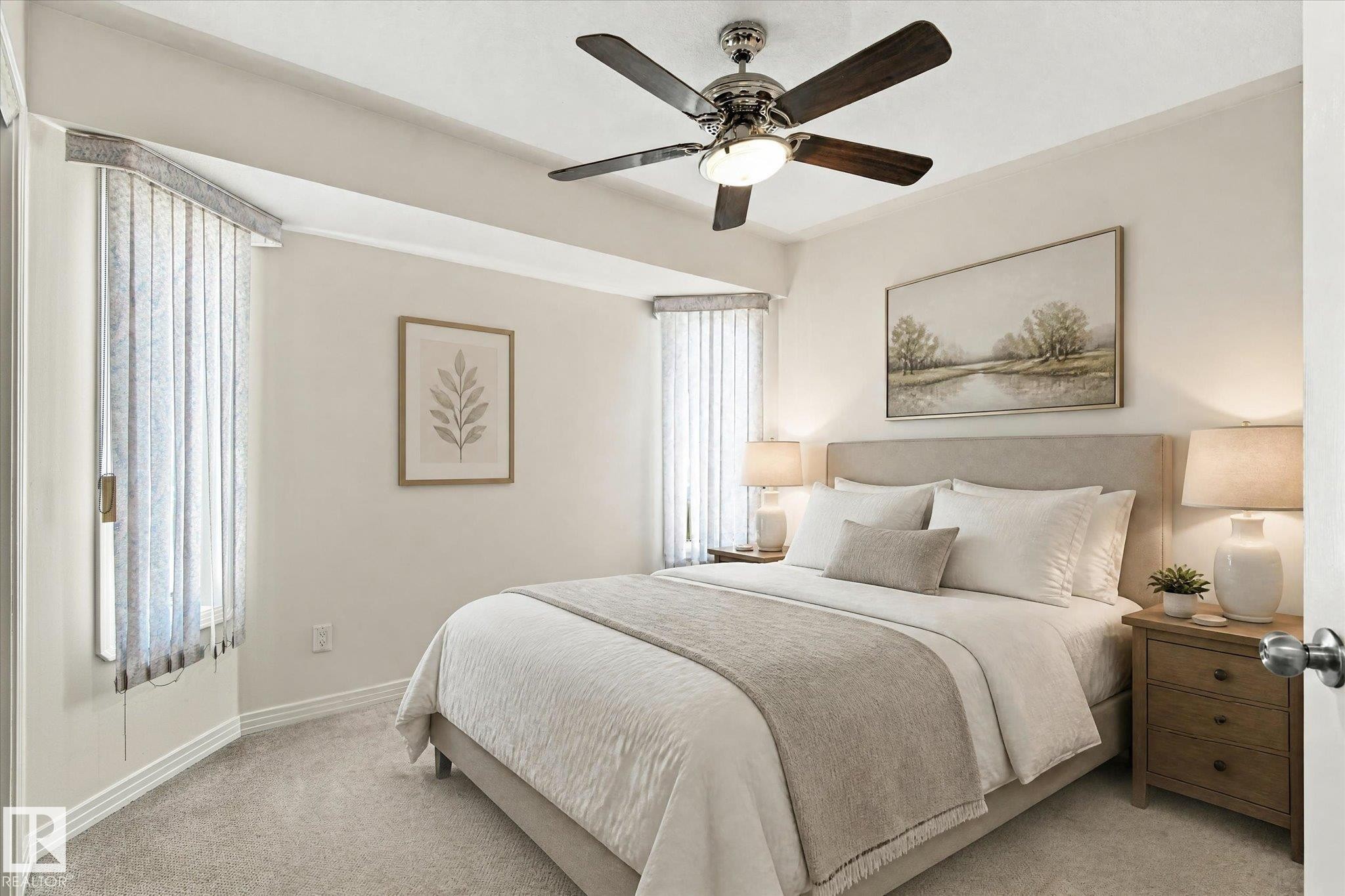 Recessed ceiling fan with integrated lighting, window with vertical blinds, neutral wall paint, light-toned carpet flooring, and a fabric-upholstered headboard - 771 Johns Road Nw, Edmonton, AB