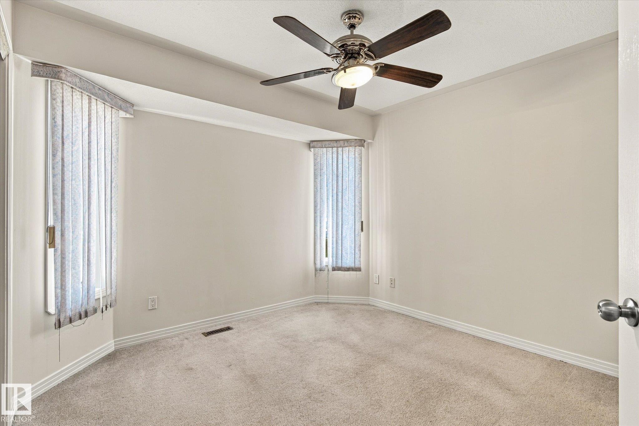 Recessed lighting with a ceiling fan, light-toned walls, and soft carpet flooring - 771 Johns Road Nw, Edmonton, AB