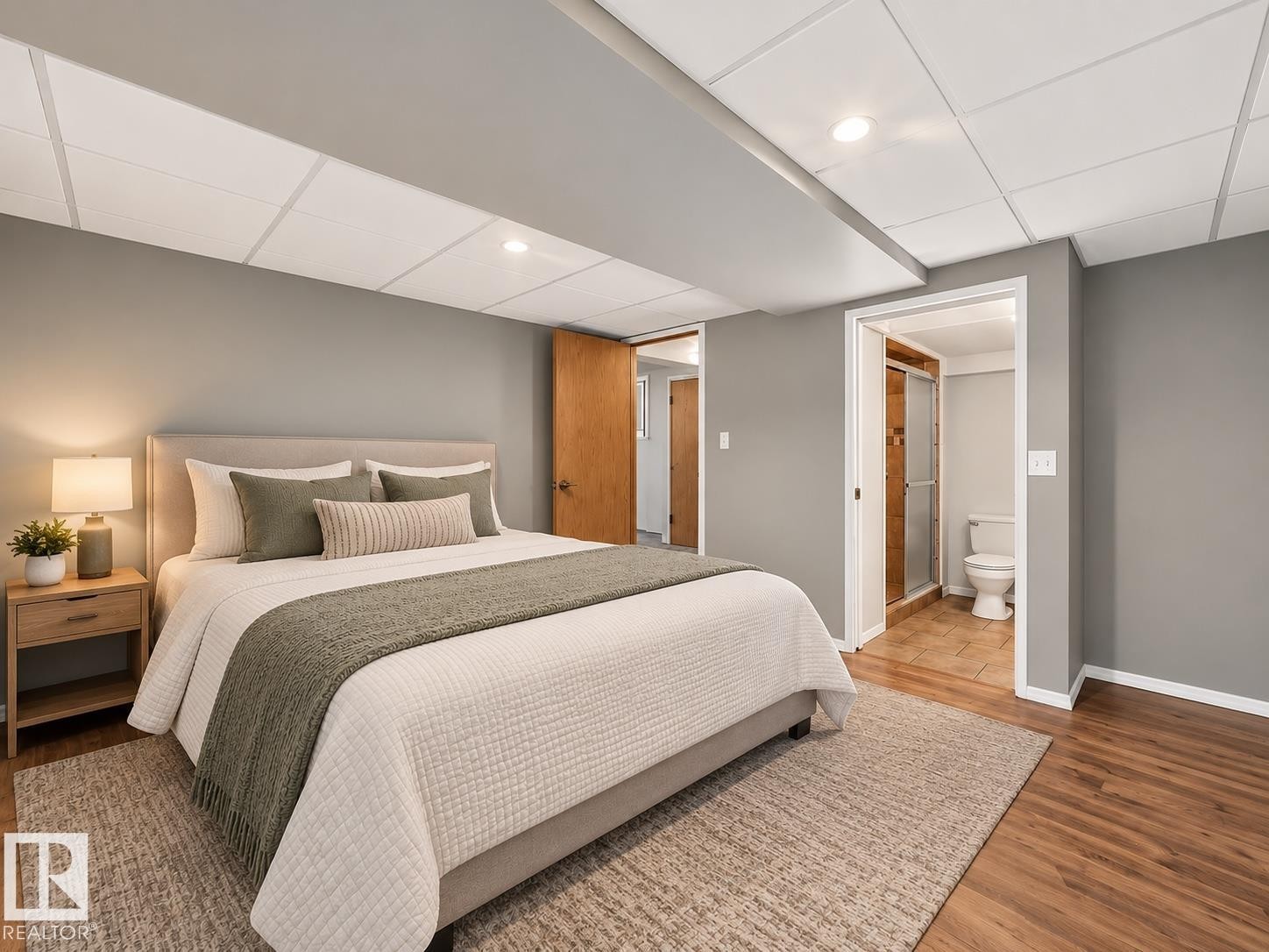 Recessed lighting, wood-finish flooring, drop ceiling, and a bathroom with a glass-enclosed shower - 14519 32 Street Nw, Edmonton, AB