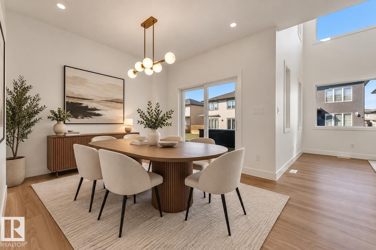 Wood-finish flooring with recessed lighting, high ceilings, large windows, and a sliding glass door - 3604 44 Avenue, Beaumont, AB