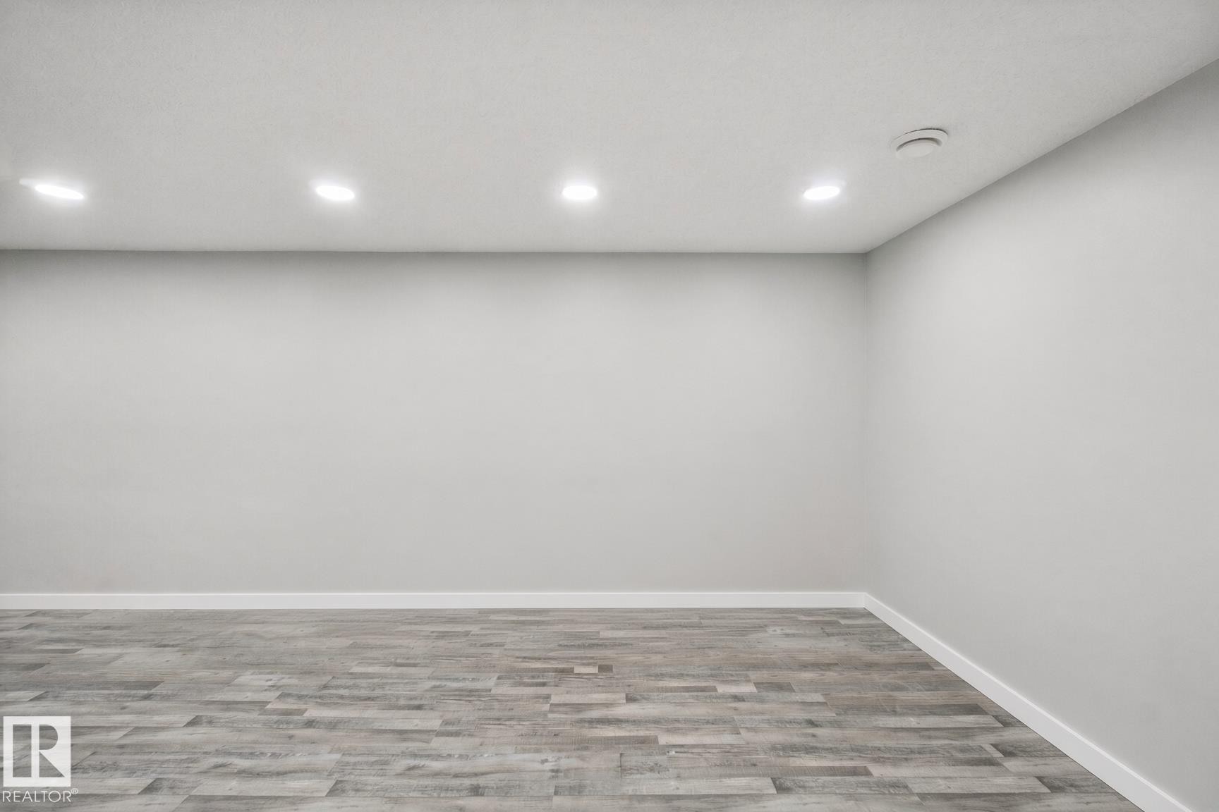 Recessed ceiling lighting with wood-finish flooring - 13212 73 Street Nw, Edmonton, AB