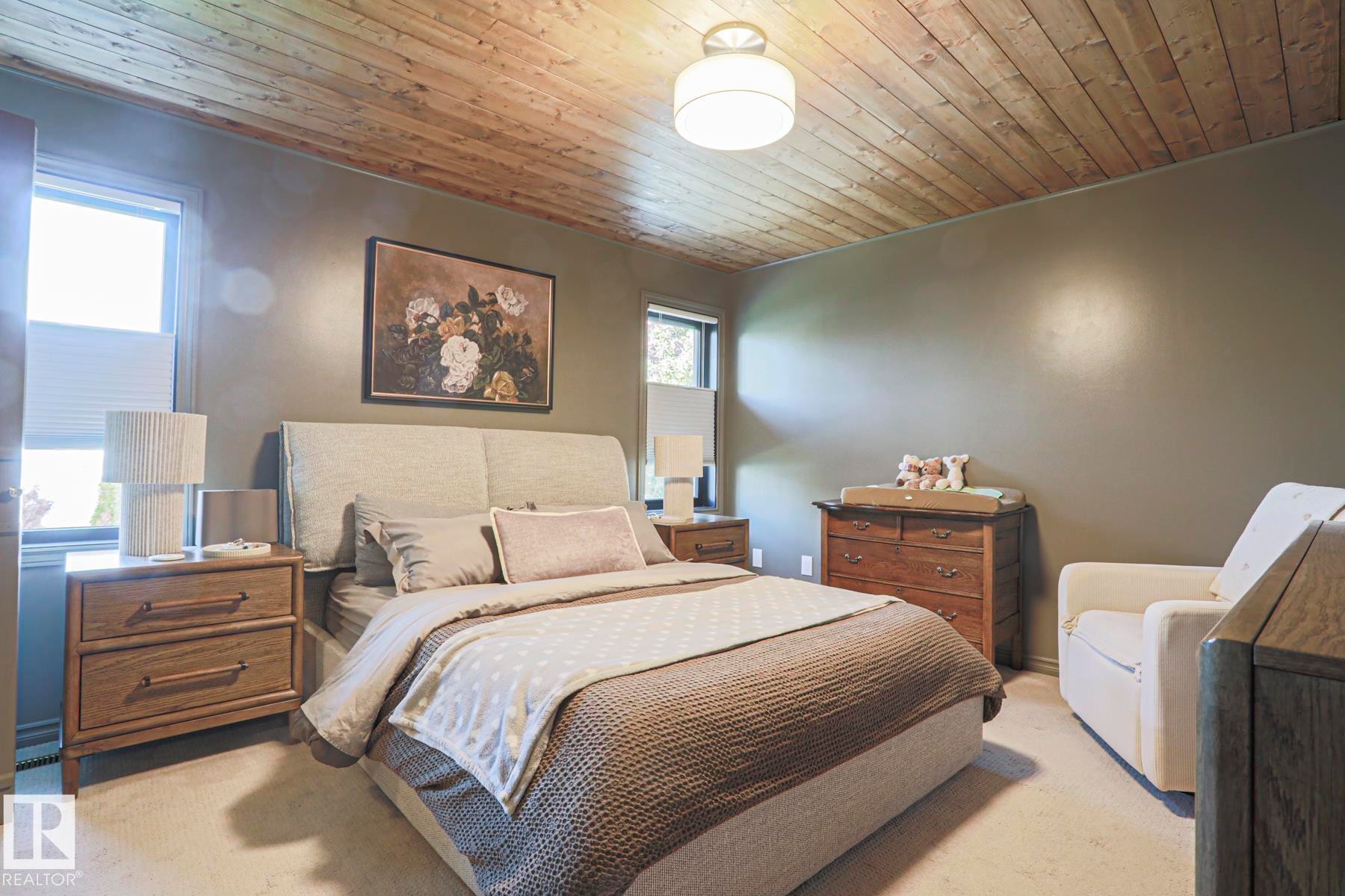 Wood-paneled ceiling, recessed lighting, wall-to-wall carpeting, and multiple windows - 2 Hillview Crescent, Sherwood Park, AB
