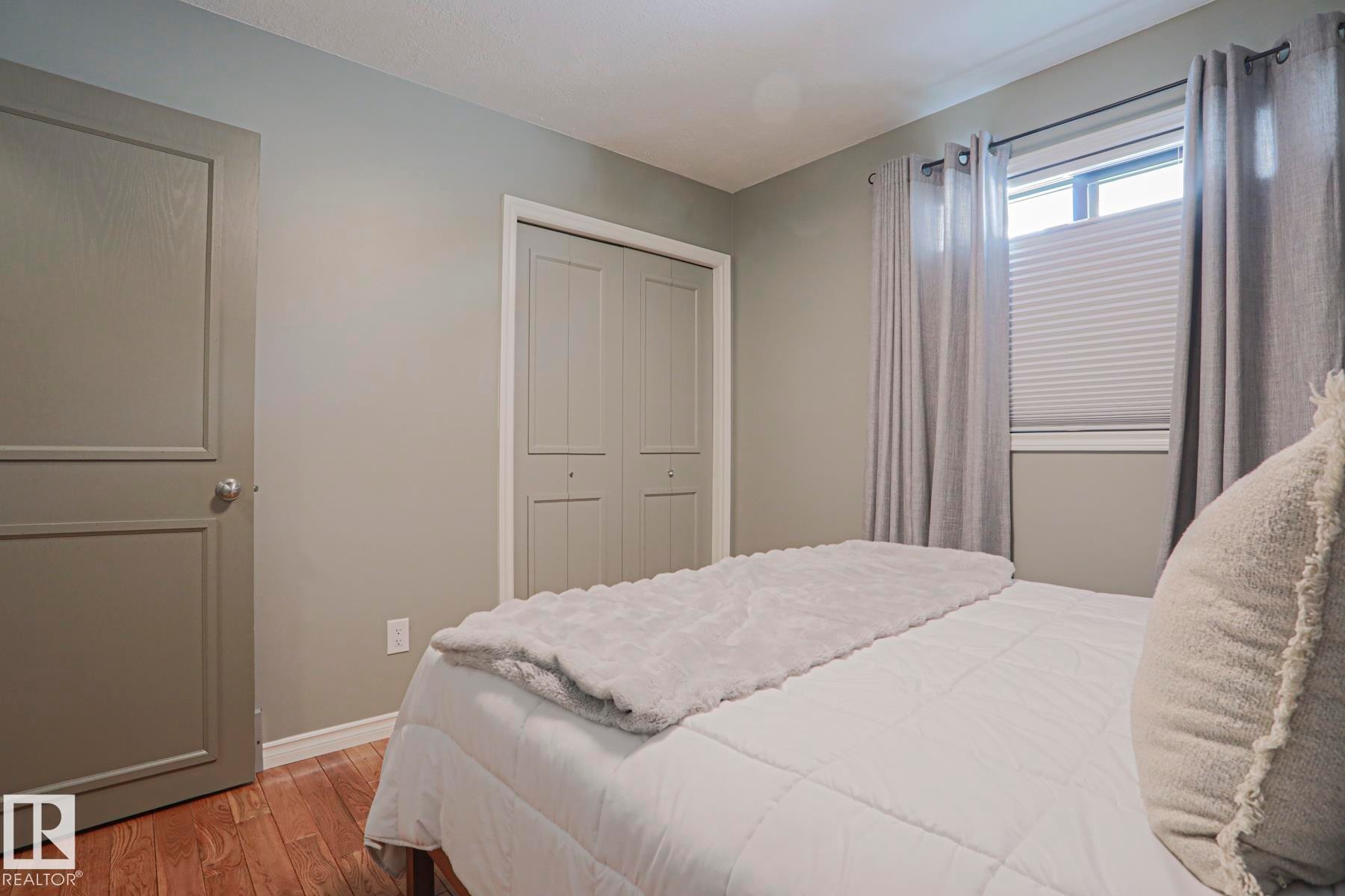 Wood-finish flooring with light-colored walls - 2 Hillview Crescent, Sherwood Park, AB