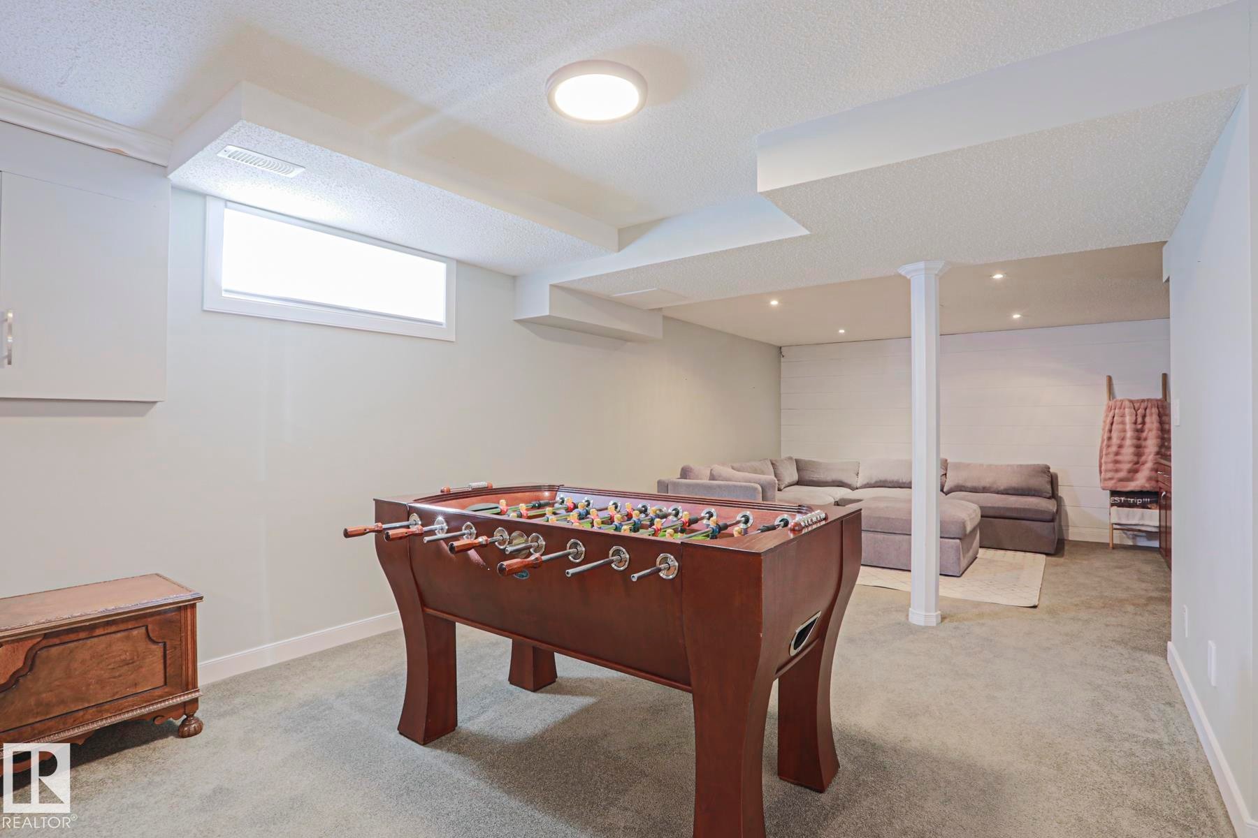 Recessed lighting, surface-mounted ceiling fixture, window, support column, and wall-to-wall carpeting - 2 Hillview Crescent, Sherwood Park, AB