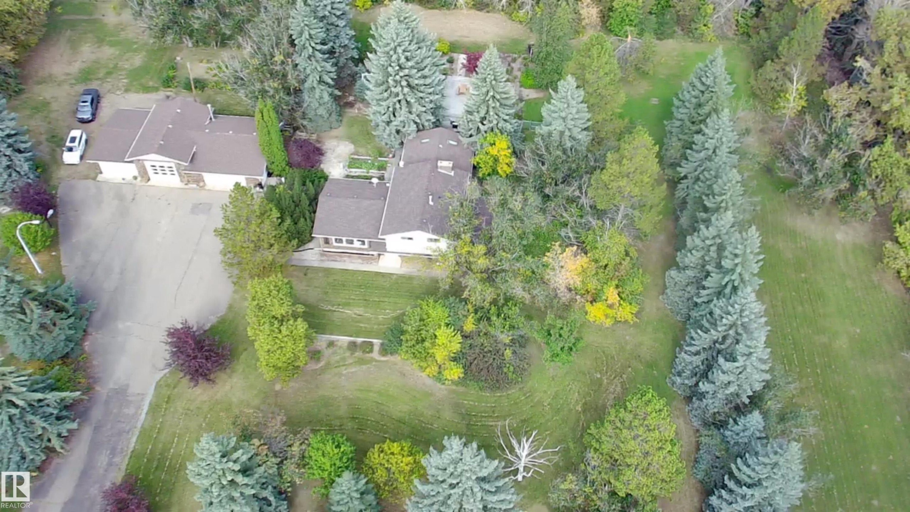 Expansive property with mature landscaping and established coniferous trees - #74 22555 Twp Road 530, Rural Strathcona County, AB
