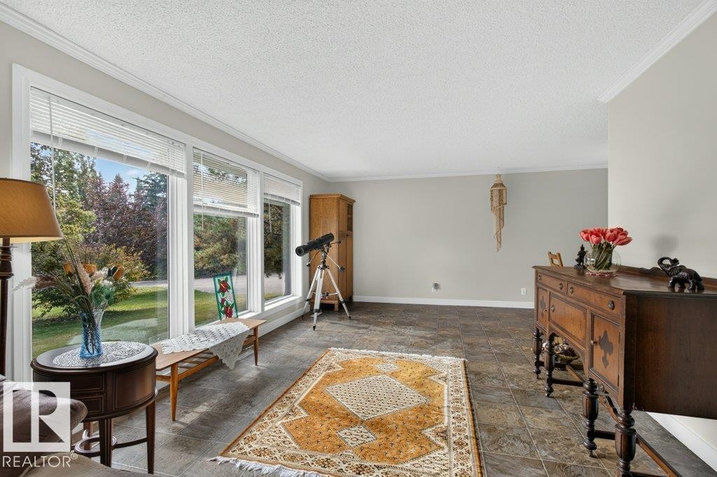Expansive window wall with white trim, offering abundant natural light - #74 22555 Twp Road 530, Rural Strathcona County, AB