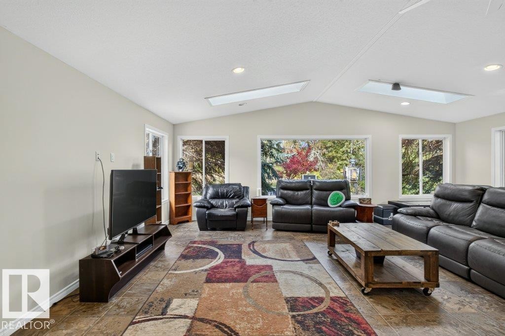 Vaulted ceiling with skylights and recessed lighting - #74 22555 Twp Road 530, Rural Strathcona County, AB