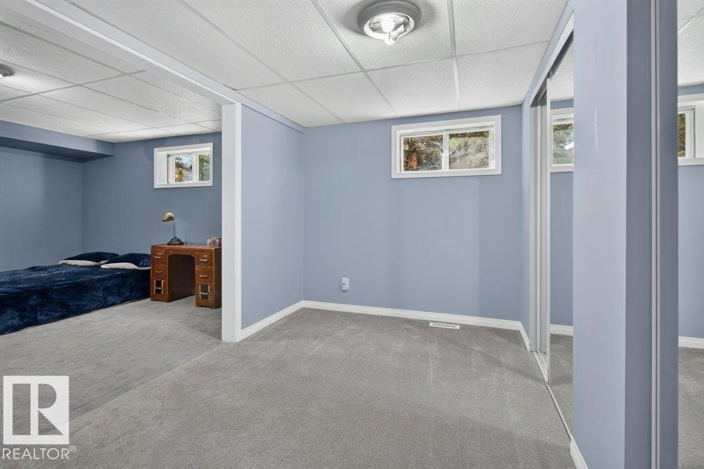 Carpeted flooring, recessed lighting, and multiple windows - #74 22555 Twp Road 530, Rural Strathcona County, AB