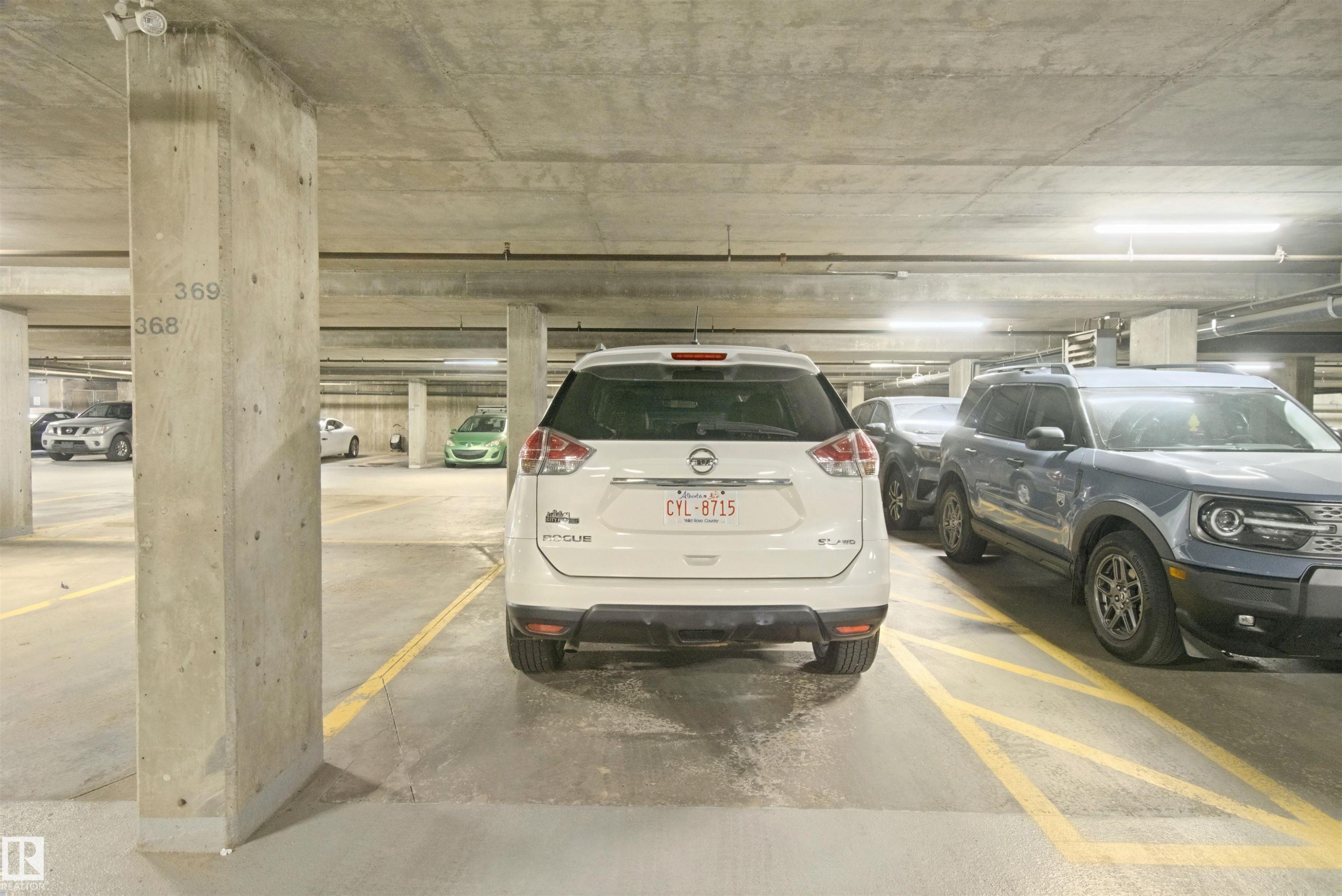 Underground concrete parking facility with designated parking spaces - #208 16035 132 St Nw, Edmonton, AB