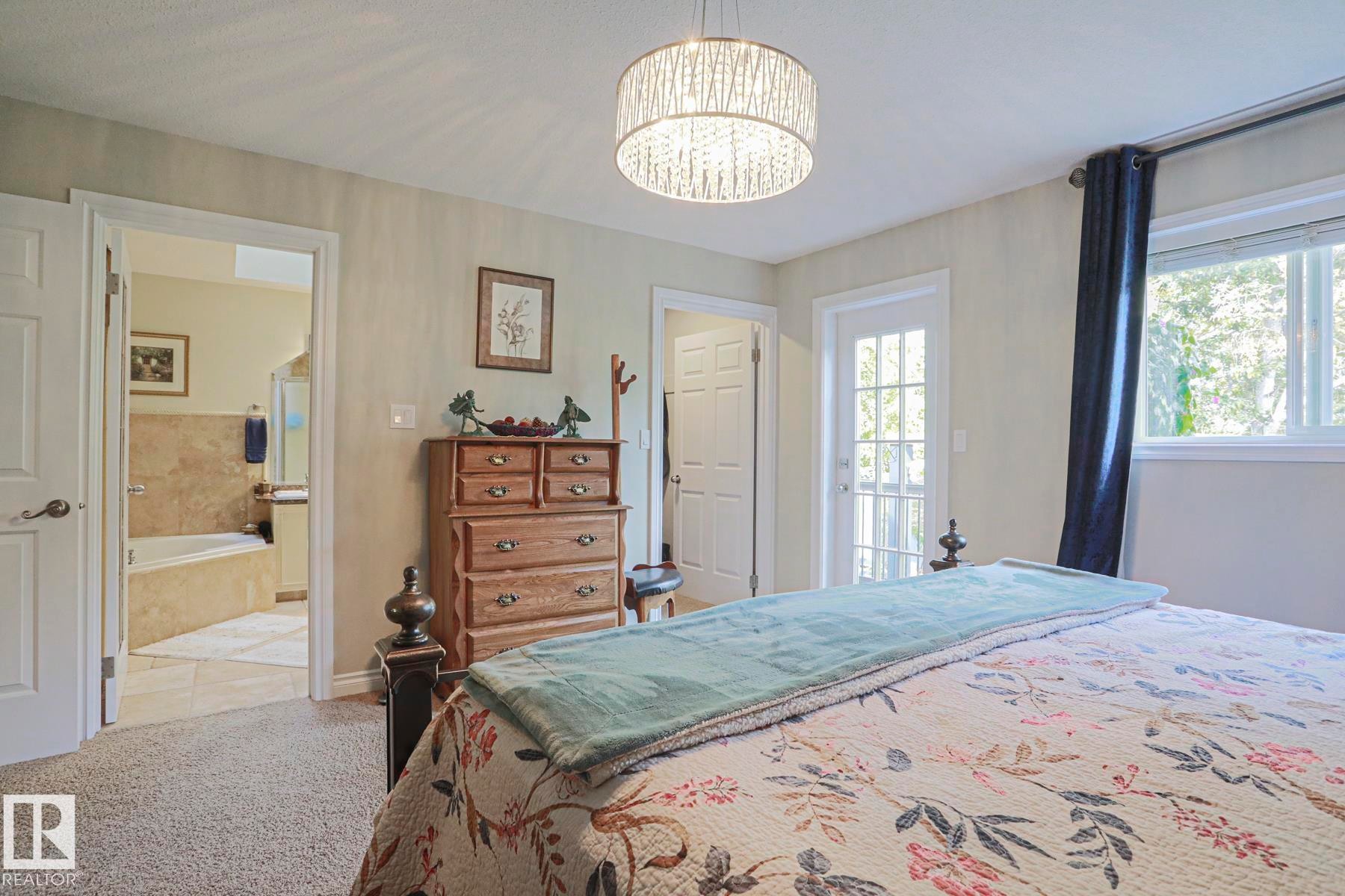 Recessed lighting, light-colored walls, carpeted flooring, and a private balcony door - 3815 41 Street Nw, Edmonton, AB