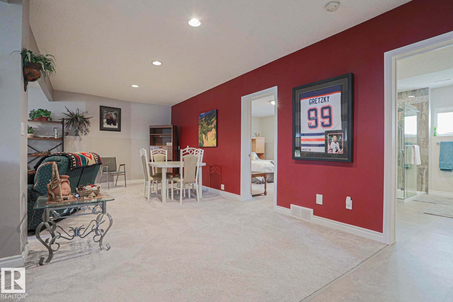 Recessed lighting illuminates the carpeted floor - 3815 41 Street Nw, Edmonton, AB