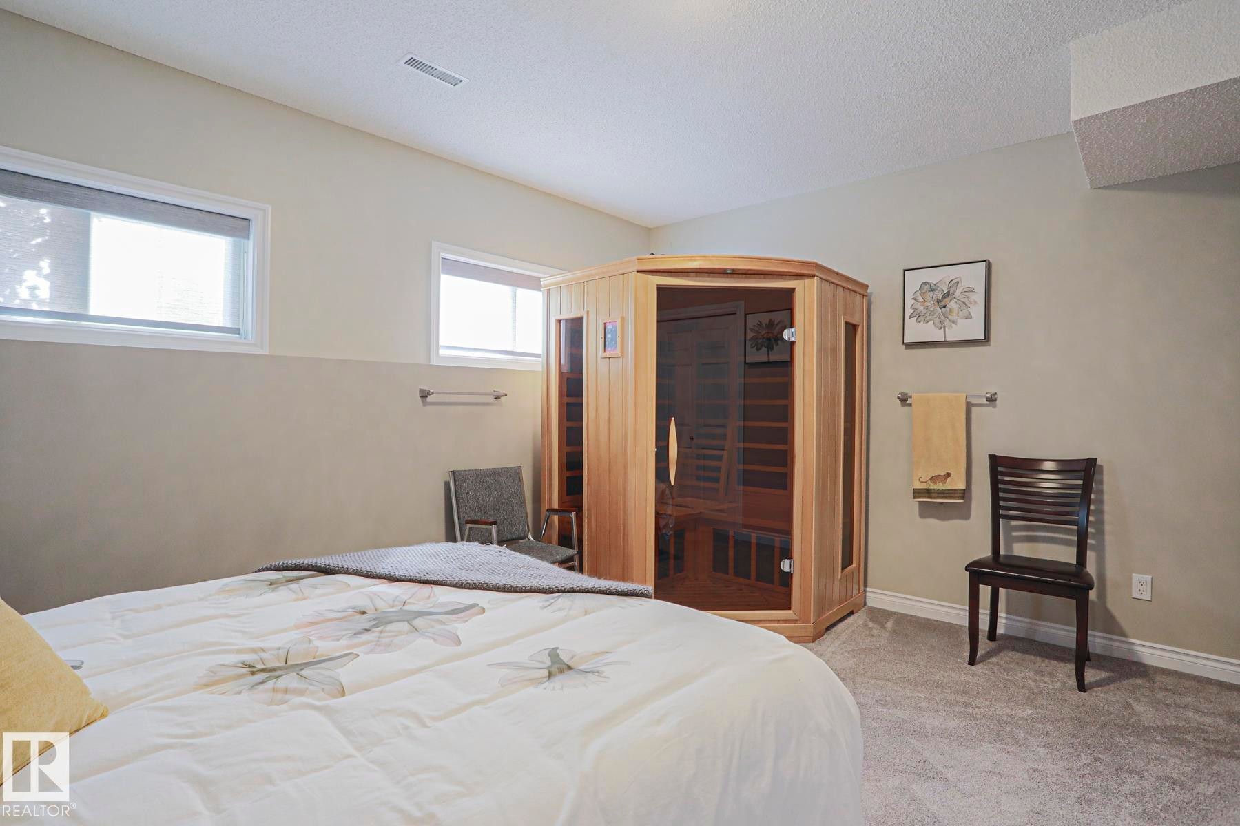 Integrated wood-paneled sauna with glass door - 3815 41 Street Nw, Edmonton, AB