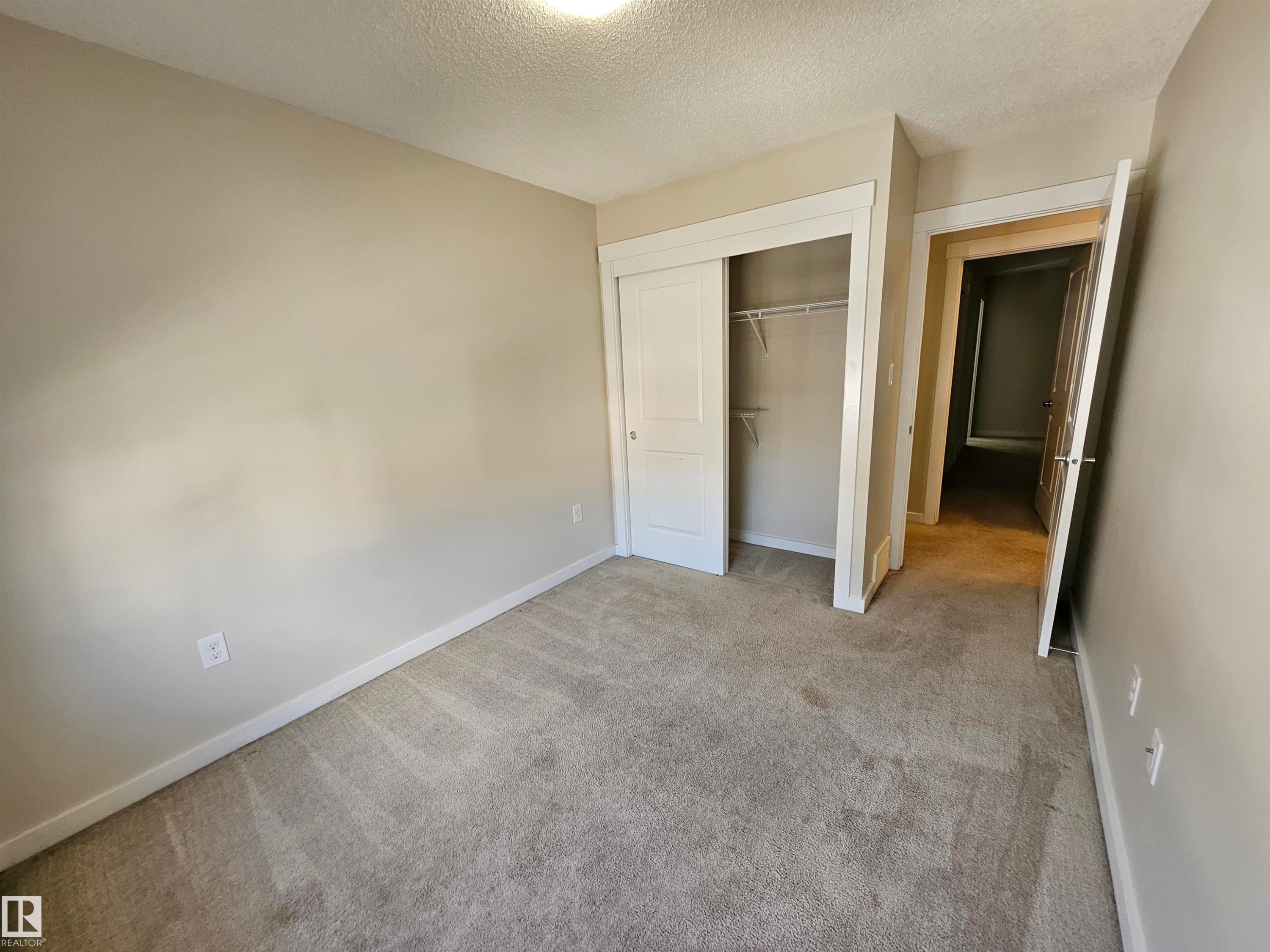 Neutral wall tones with light carpet flooring - #69 903 Crystallina Nera Wy Nw, Edmonton, AB