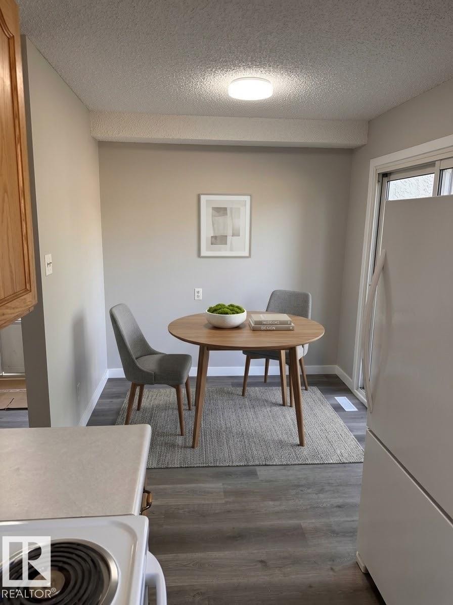 Wood-finish flooring throughout - 9G Clareview Village Nw, Edmonton, AB