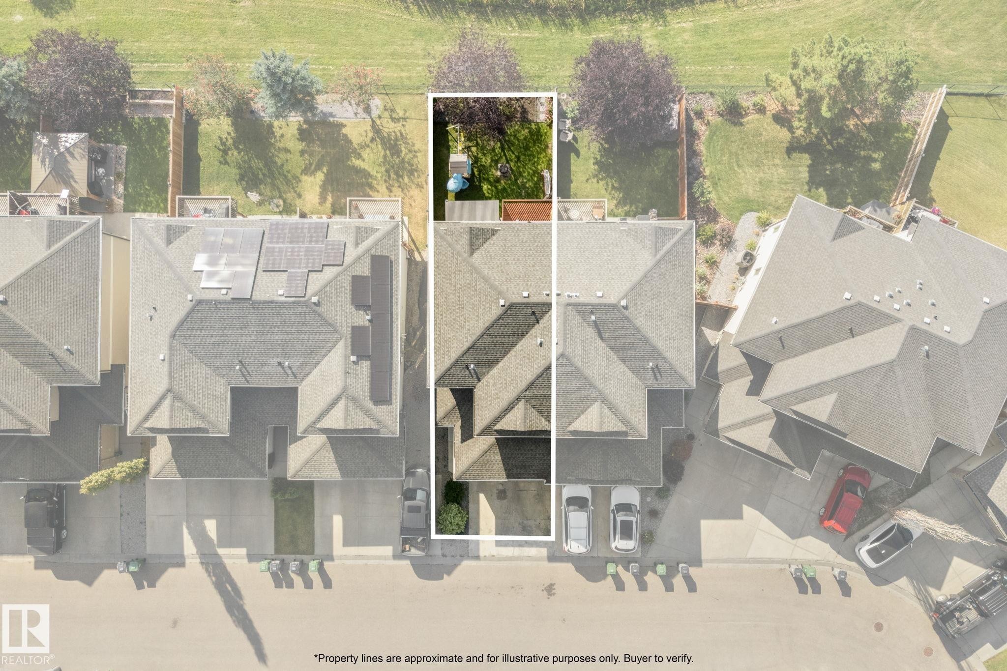 Gable roof residence featuring an attached garage and a fenced backyard with a manicured lawn - #5 4900 62 St, Beaumont, AB