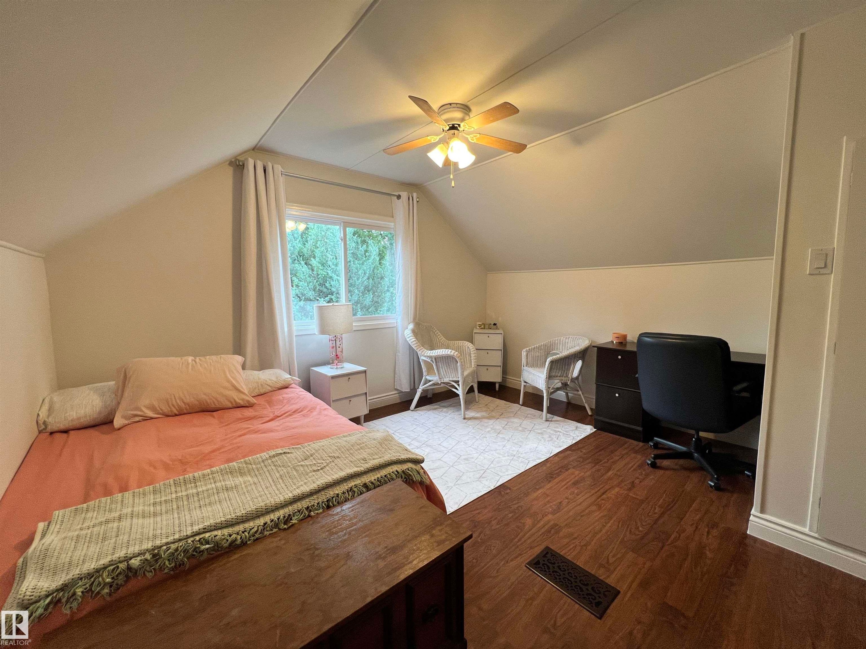 Sloped ceiling architecture with recessed lighting, wood-finish flooring, and a ceiling fan - 11908 131 Street Nw, Edmonton, AB